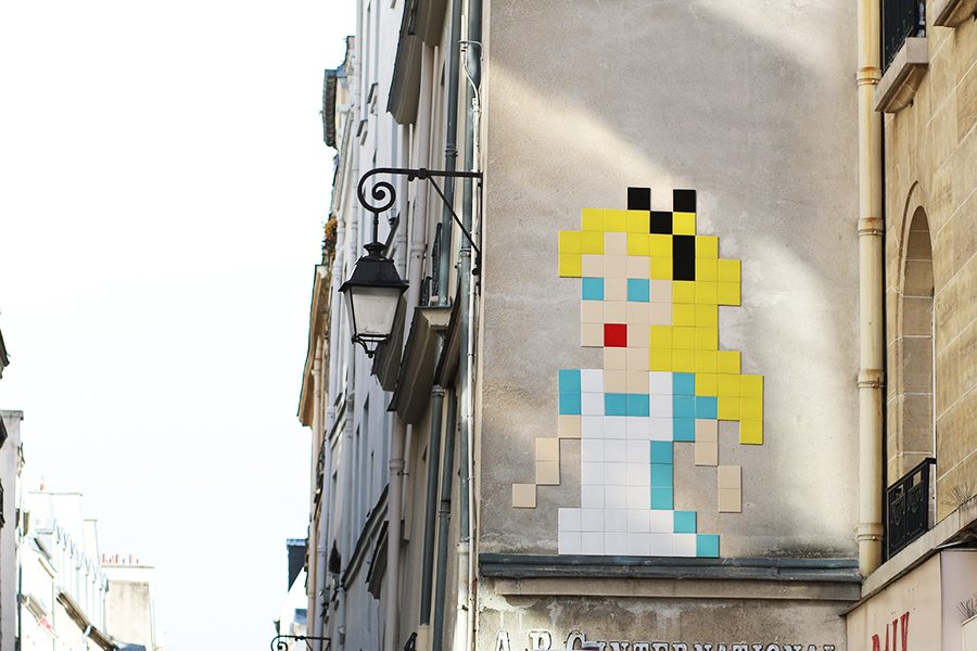 Pixelated mosaic by Invader depicting Alice… — Paris, France