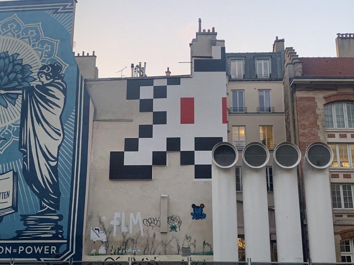 Wall mural by A2 collective famous for pixe… — Paris, France