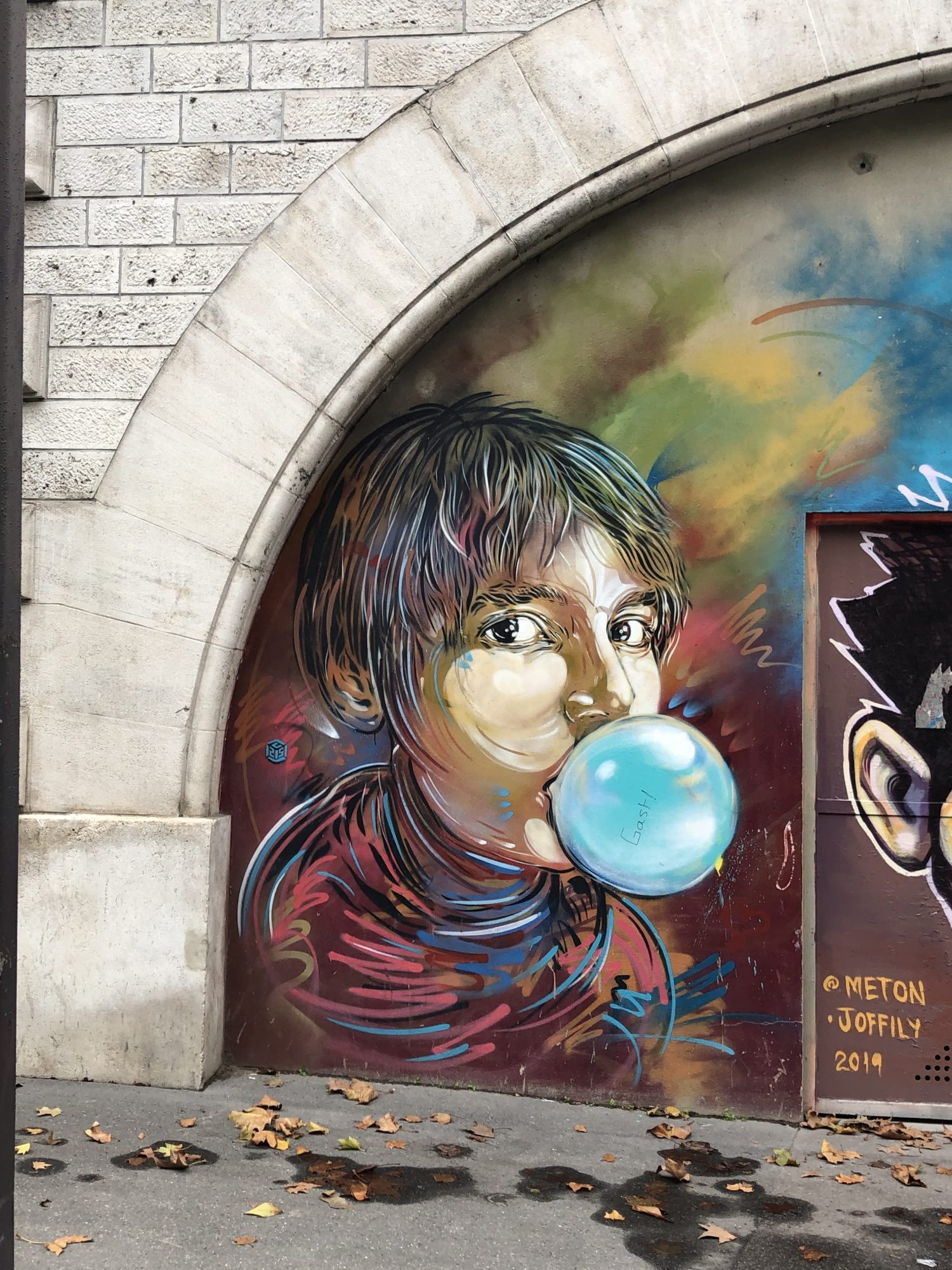 Child with Giant Bubble — Street art by C215 in Paris