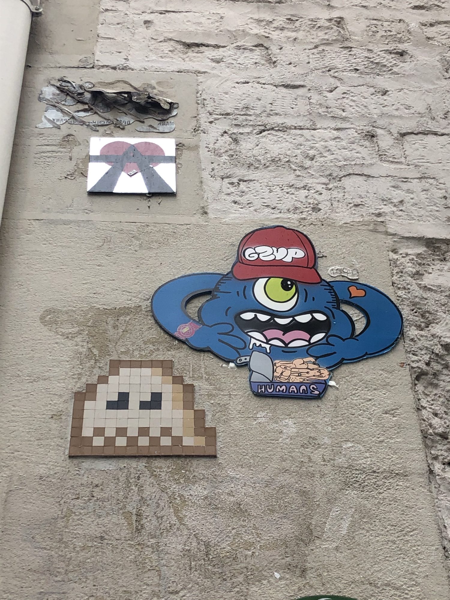 Gzup's Monster and the Ghost — Street art by A2, Gzup, Invader in Paris