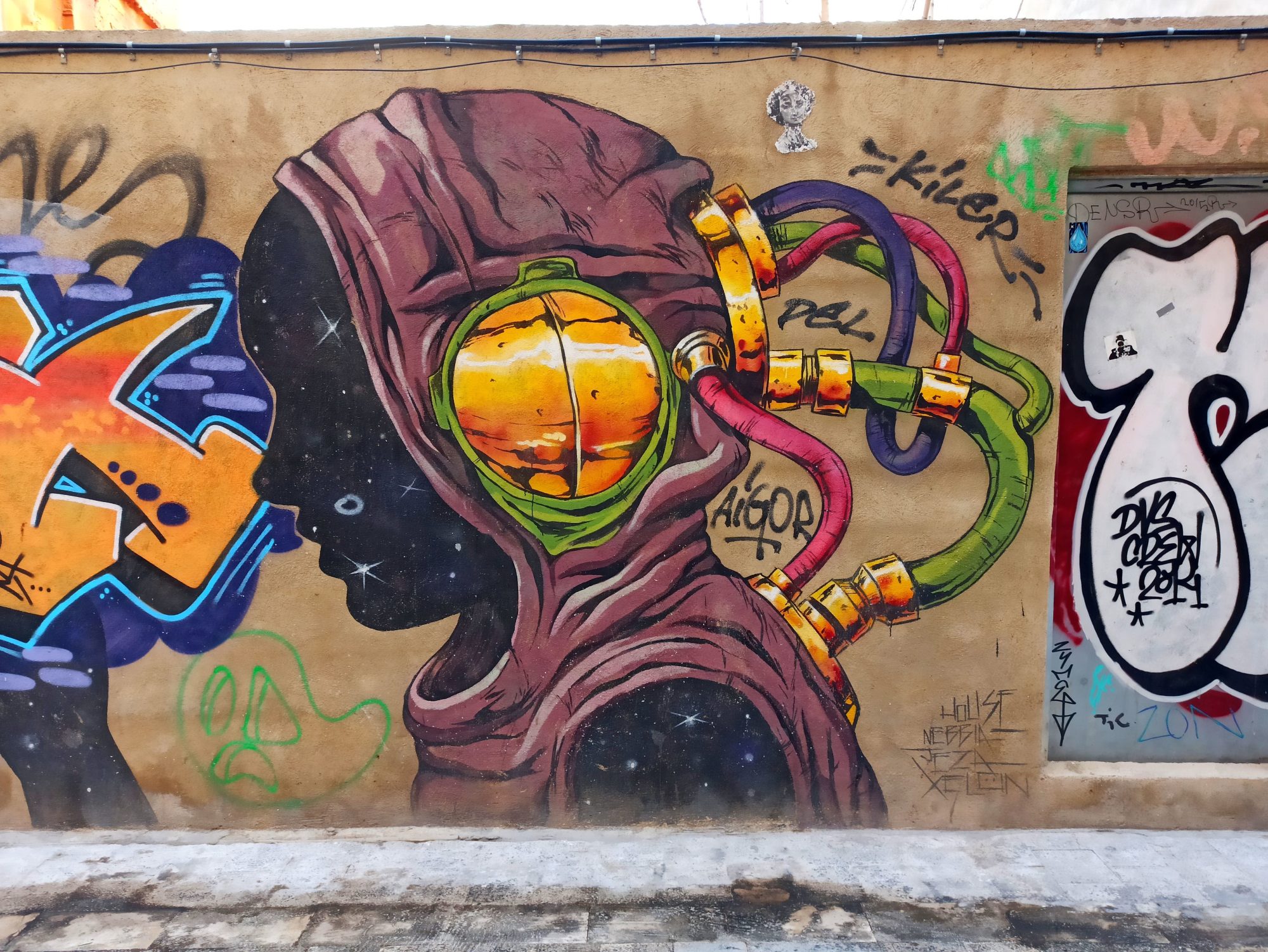 Profile with an Amber Orb — Street art by Deih xlf in València