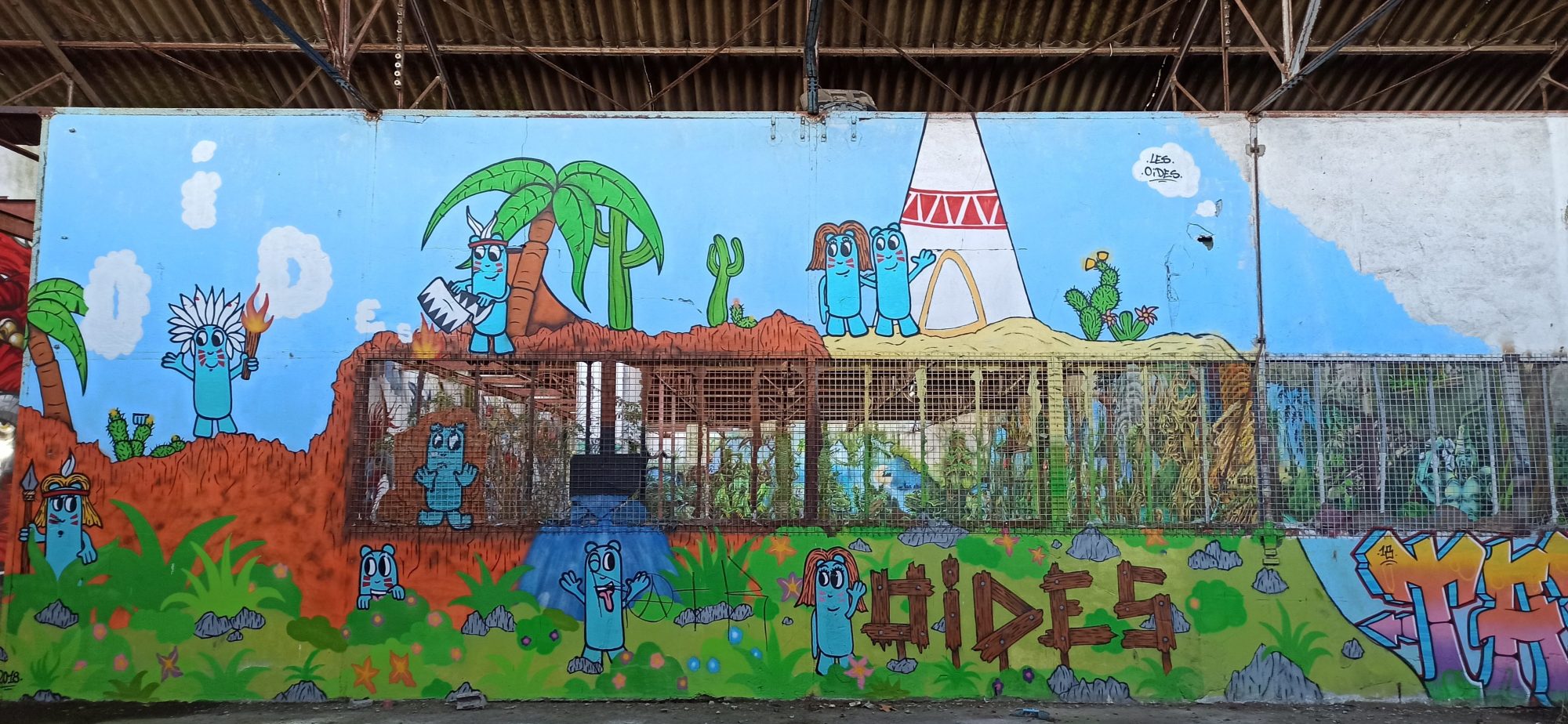 Scène naïve désert et personnages bleus Dides — Street art à Lorient