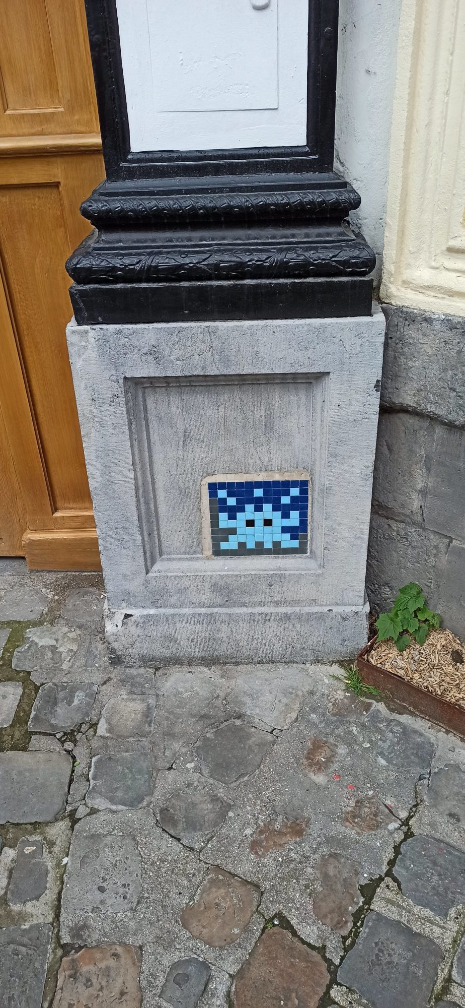 LIL_03, Blue Space Invader on a Stone Plinth — Street art by Invader in Lille