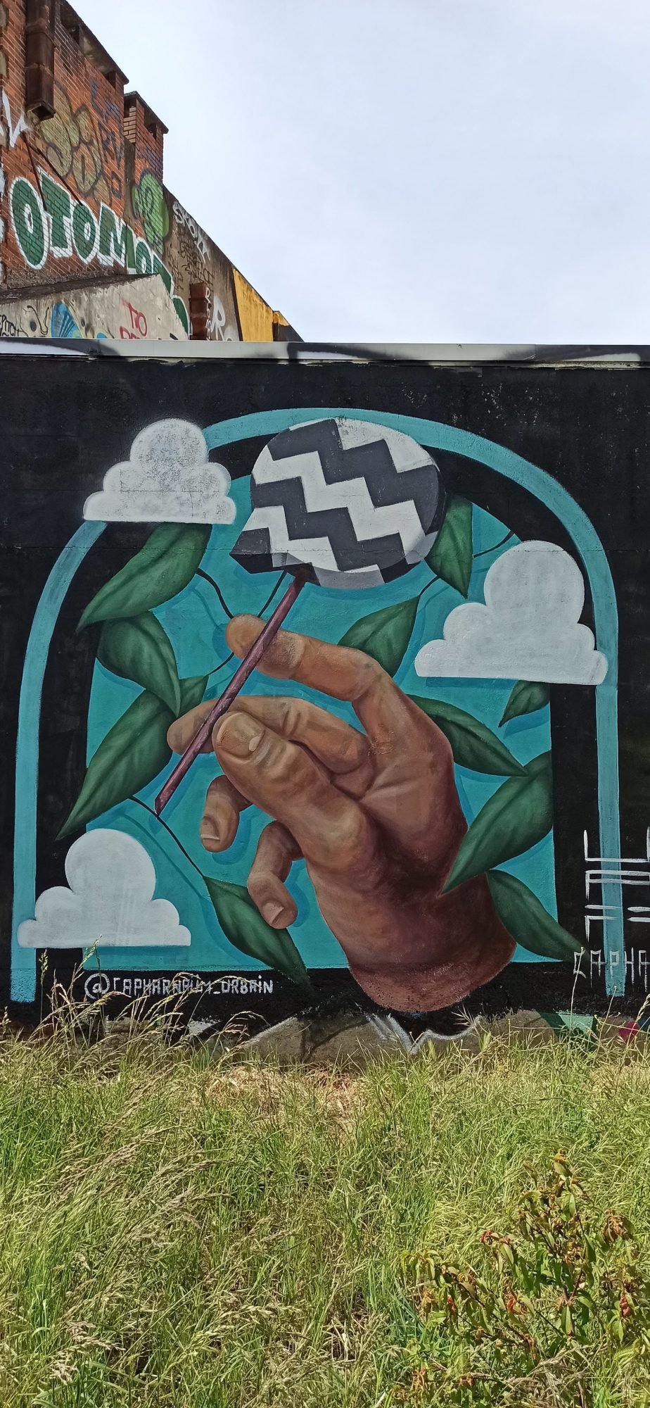 Hand and Spinning Top by CAPHAR in Nantes — Street art by CAPHAR in Nantes