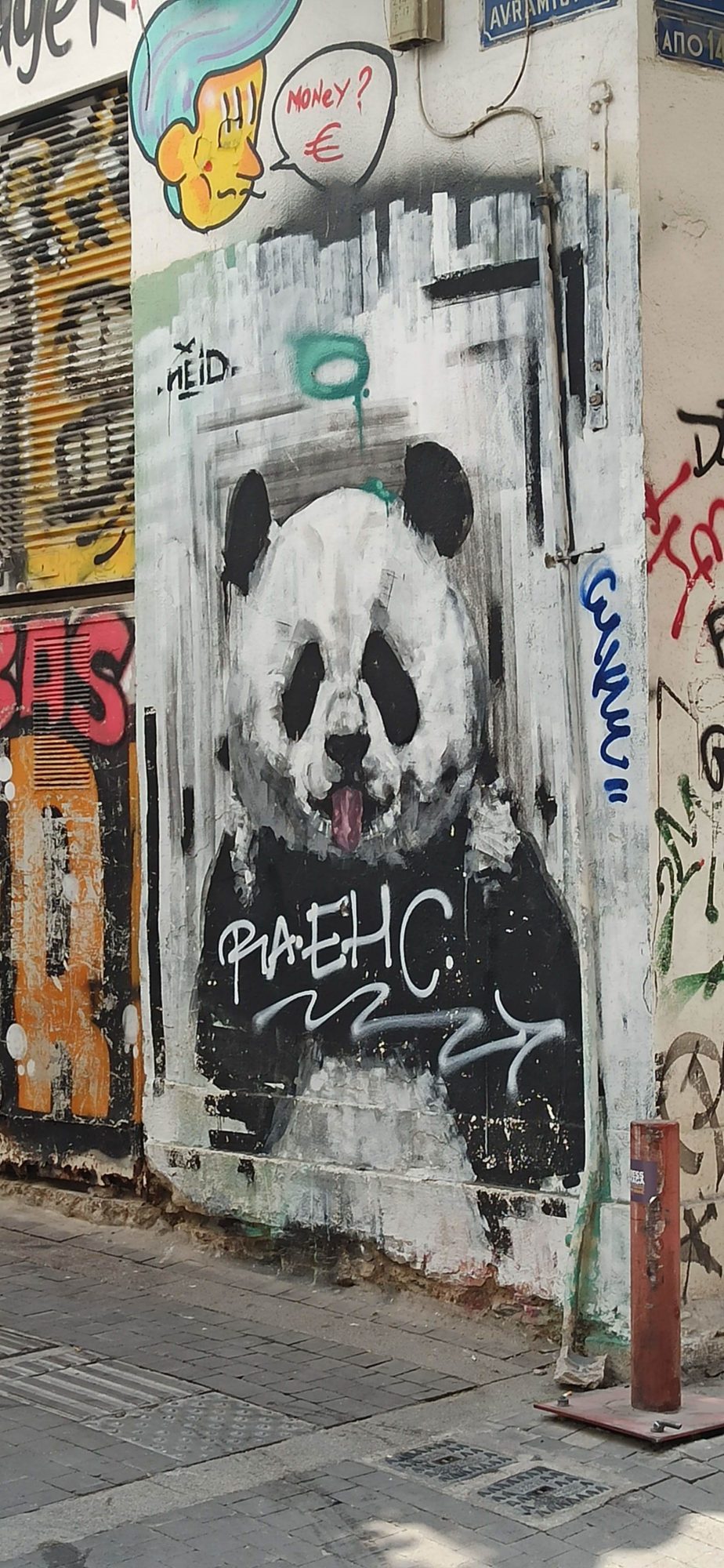 Tongue-Out Panda, Tagged Over — Street art in Athina