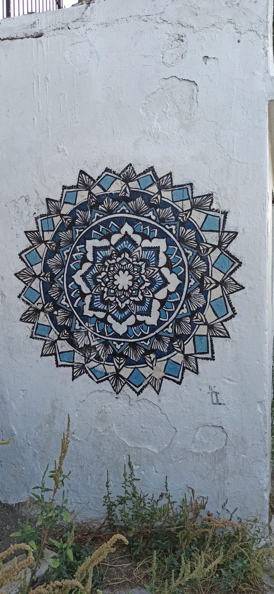 Blue and Black Mandala on a White Wall — Street art in Athina