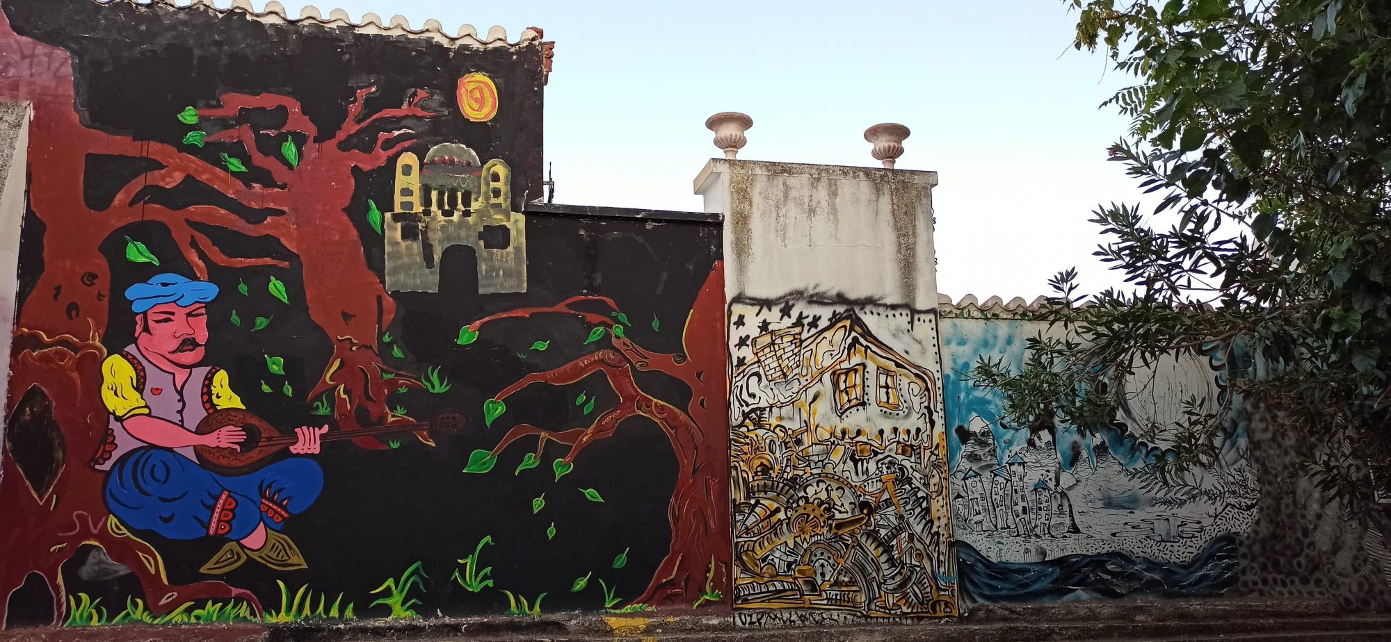 Lute Player Beneath the Red Tree — Street art in Athina