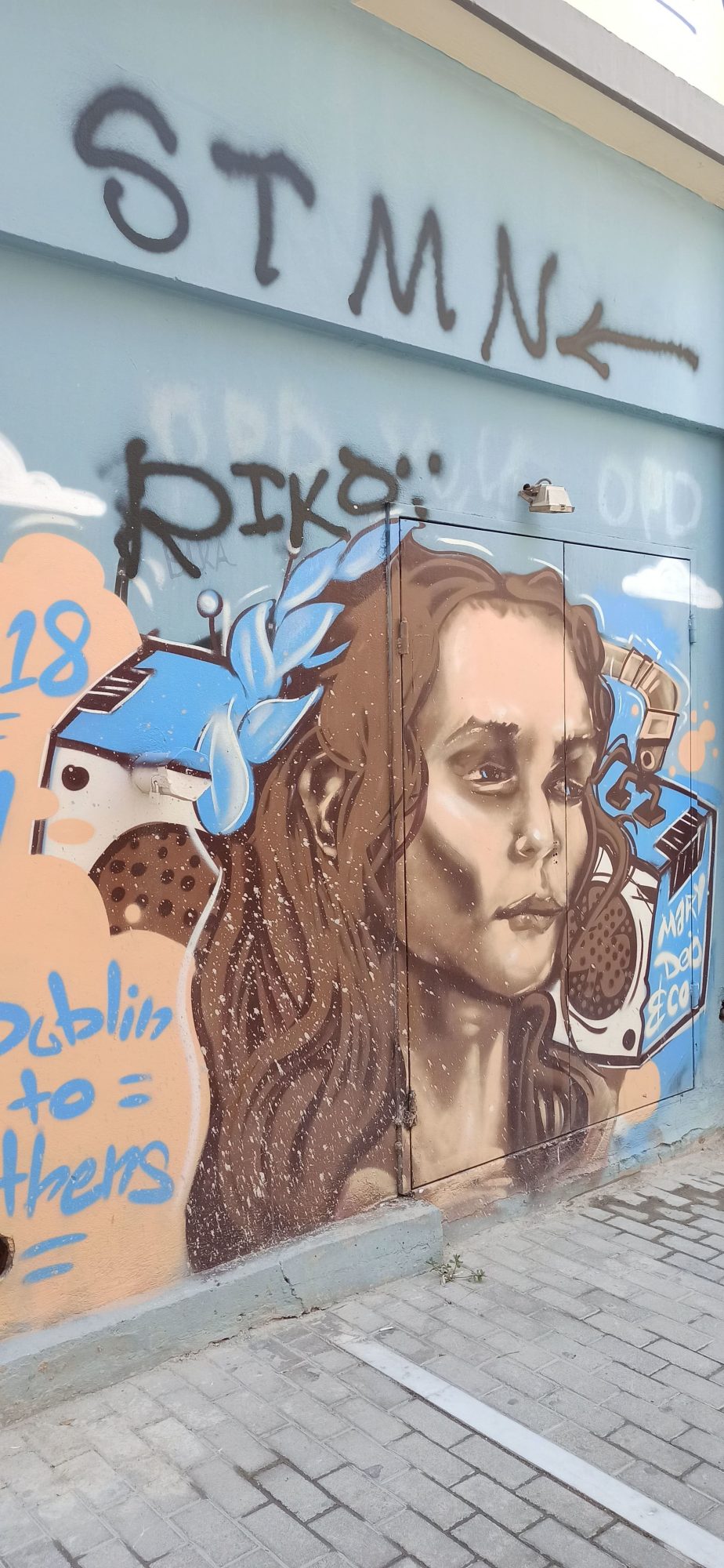 Portrait with Blue Feathers, Dublin to Athens — Street art in Athina
