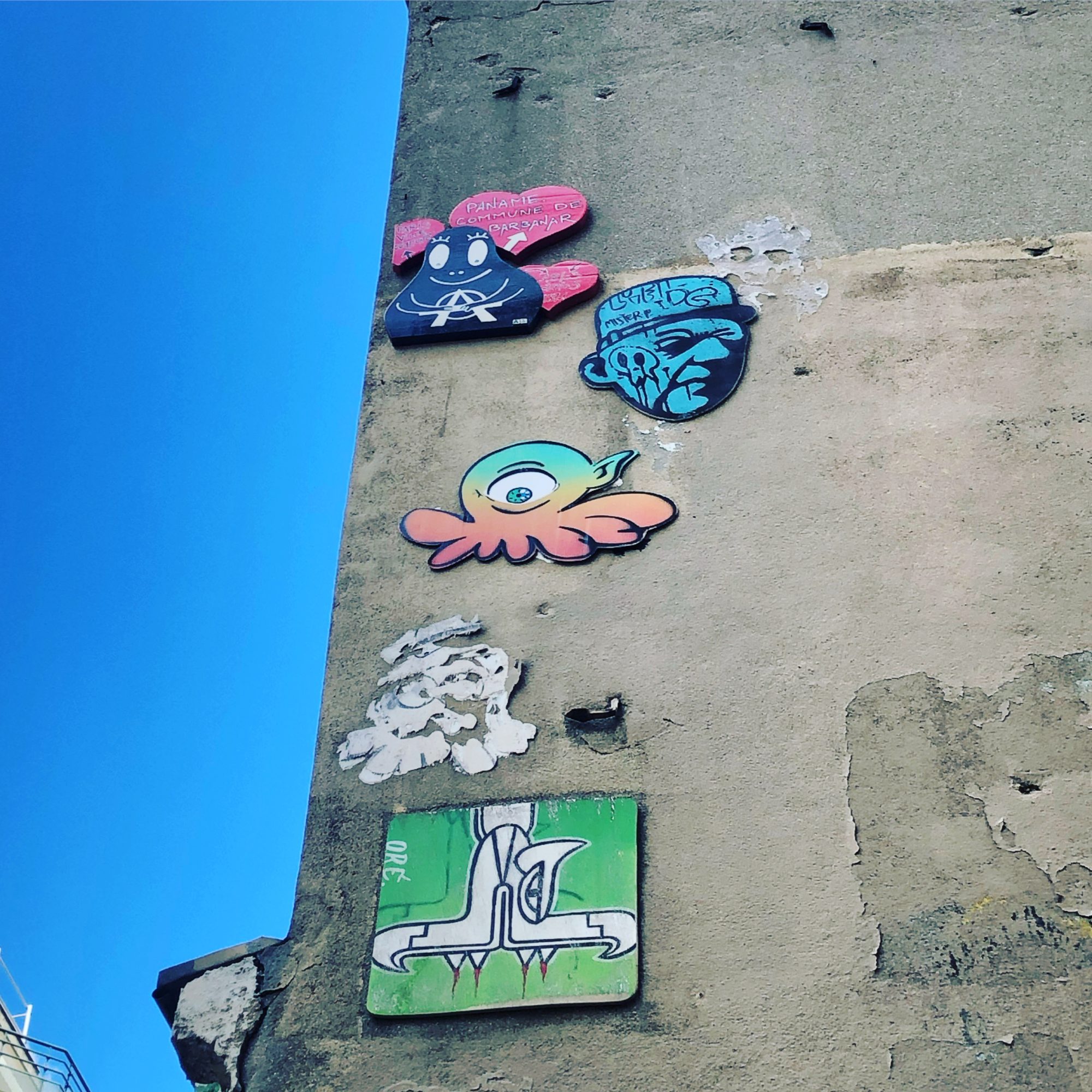 Cluster of Paste-ups on the Passage Wall — Street art by A2, Gzup, Oré, Mister P in Paris