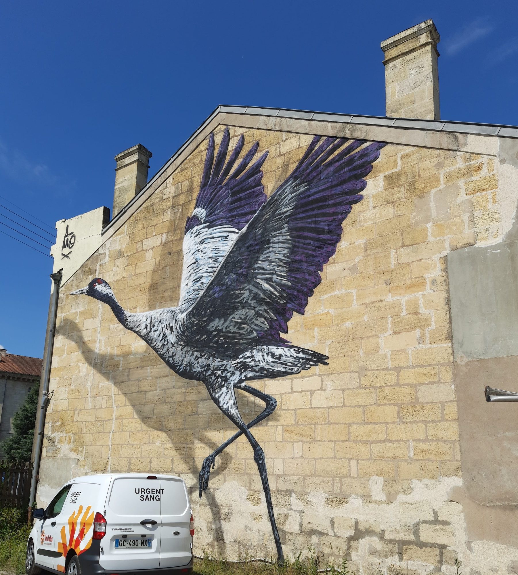 The Crane Taking Flight — Street art by A-mo in Libourne