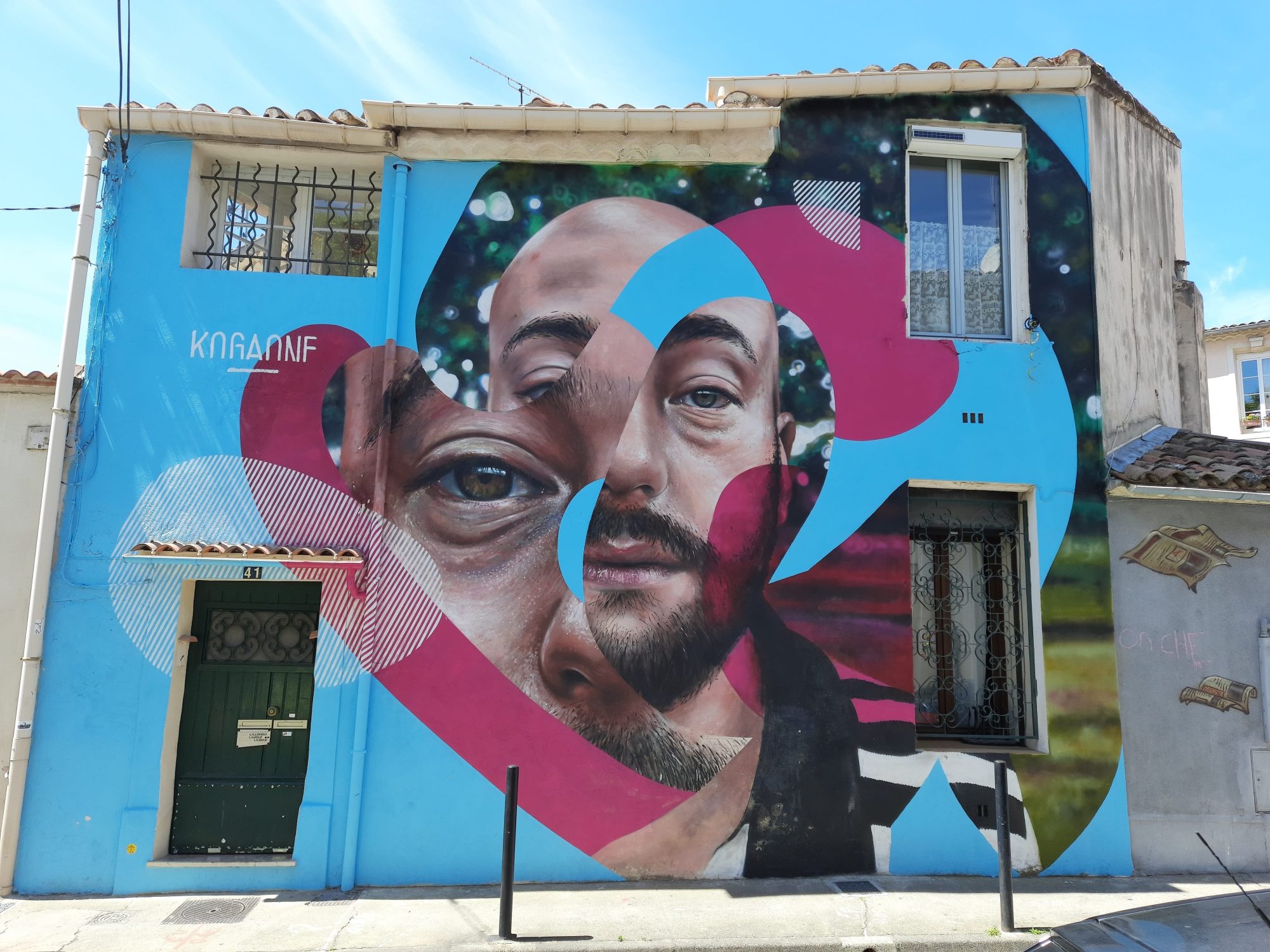 Les deux visages superposés — Street art de KogaOne à Nîmes