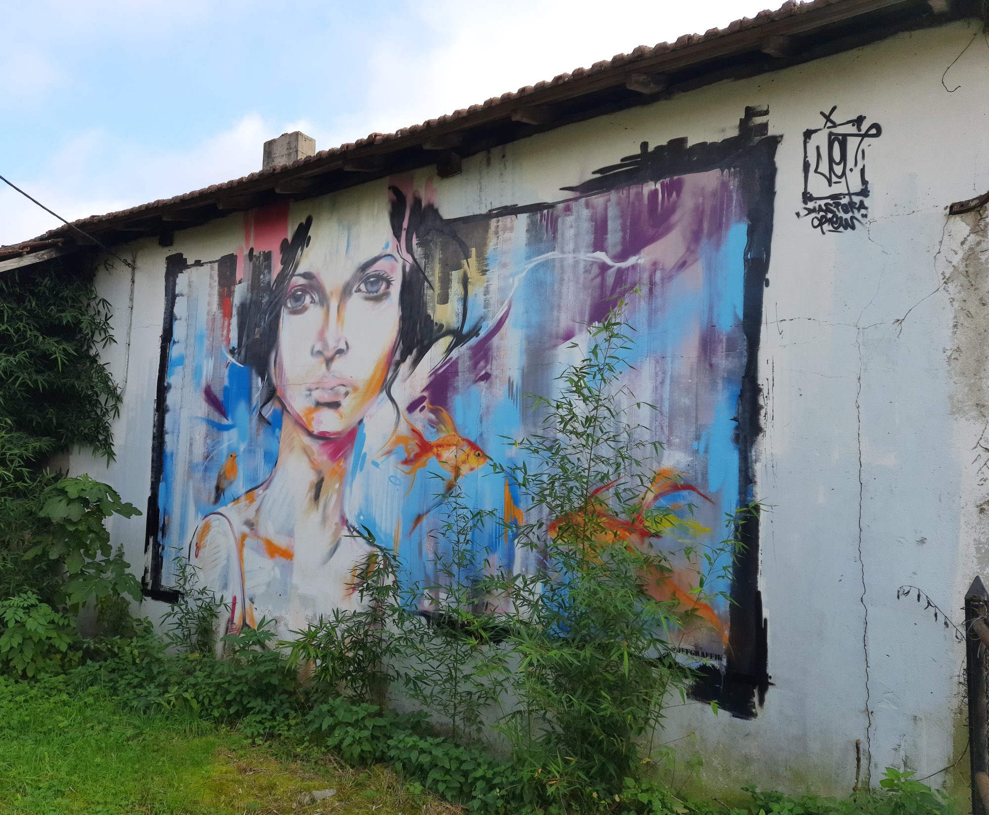 Woman Amid Blue Drips — Street art by Jef in Éauze