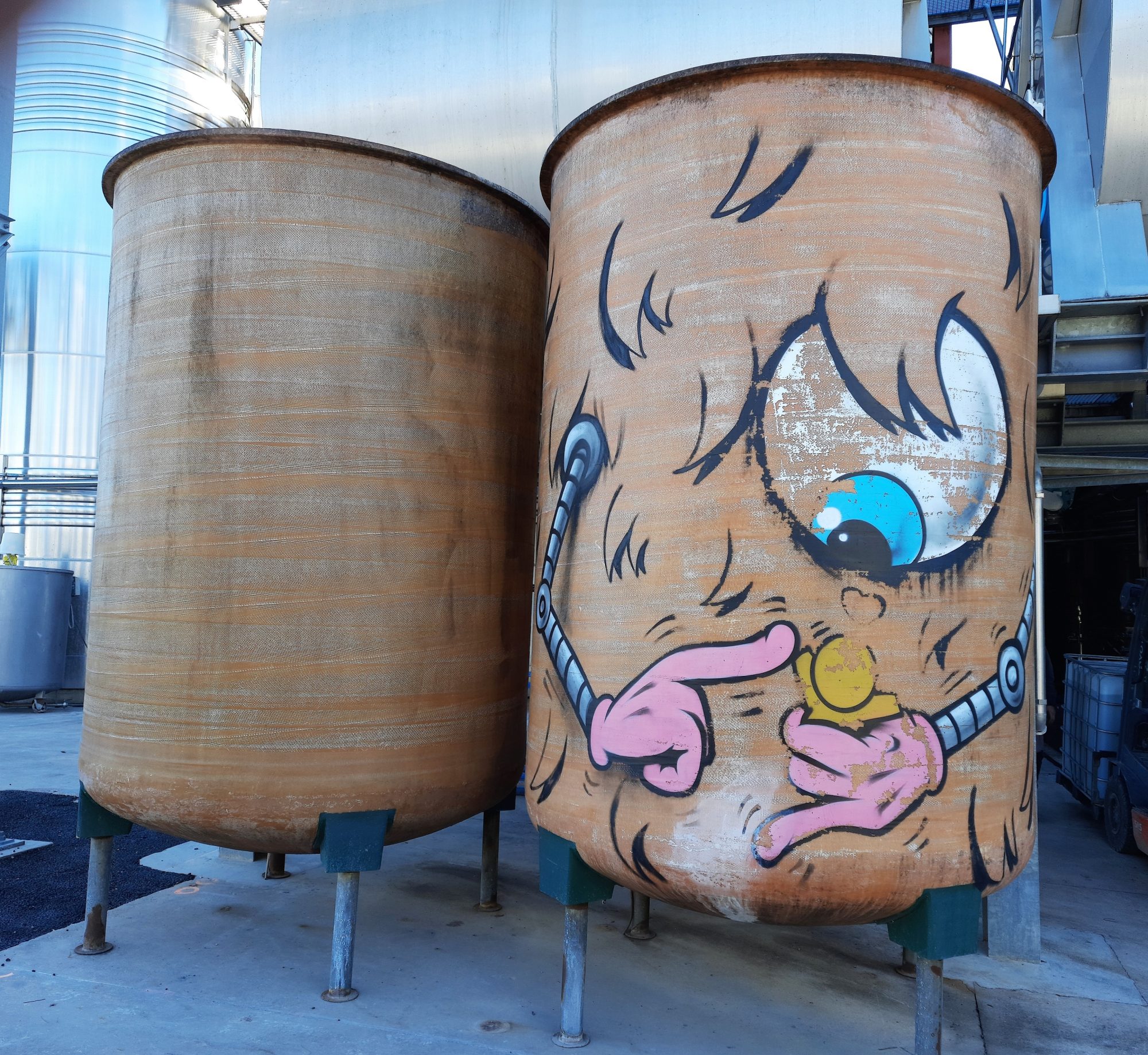 Jace's Cartoon Face on Industrial Tank — Street art by Jace in Puilacher