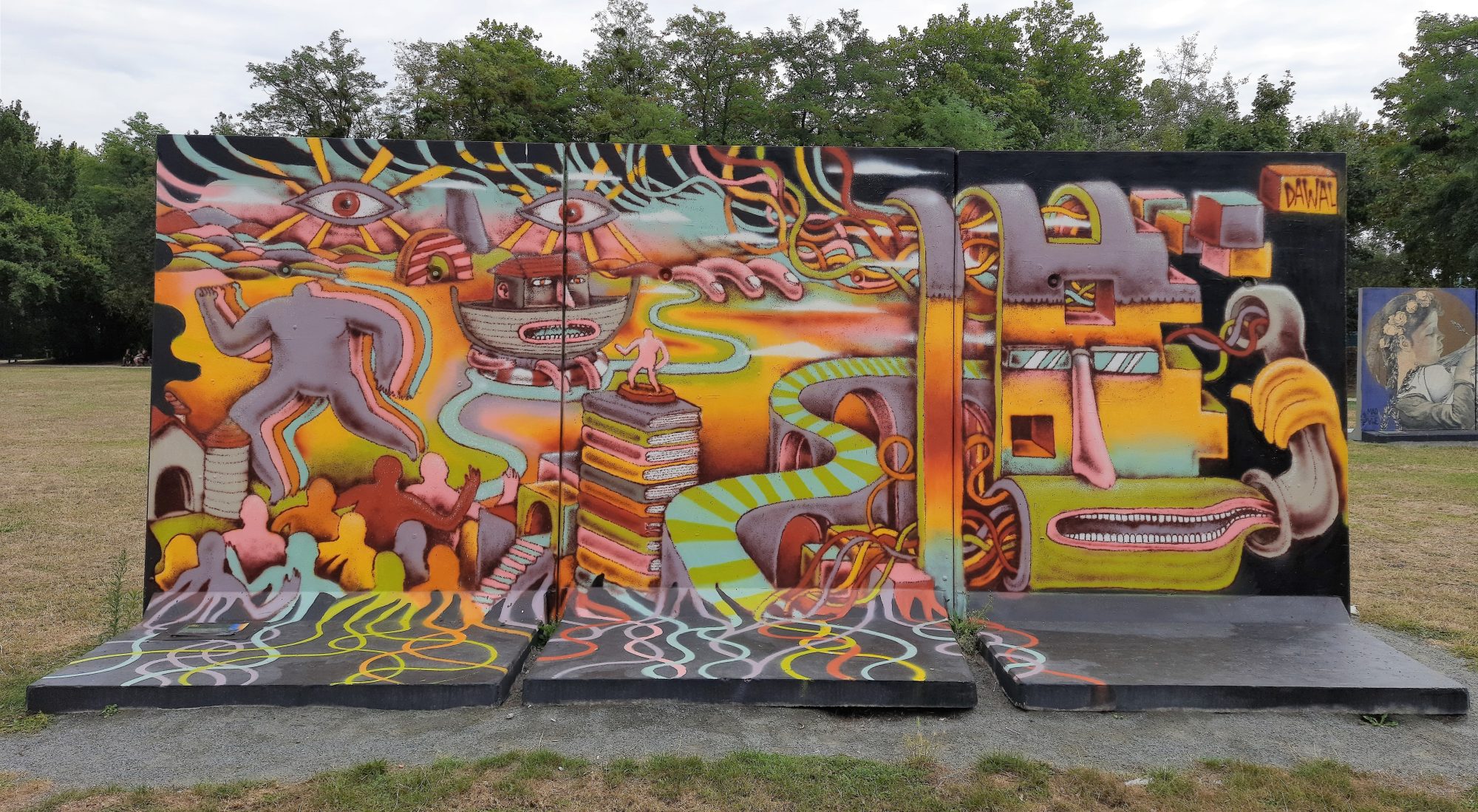 Cité surréaliste aux yeux solaires — Street art de Dawal à Le Mans