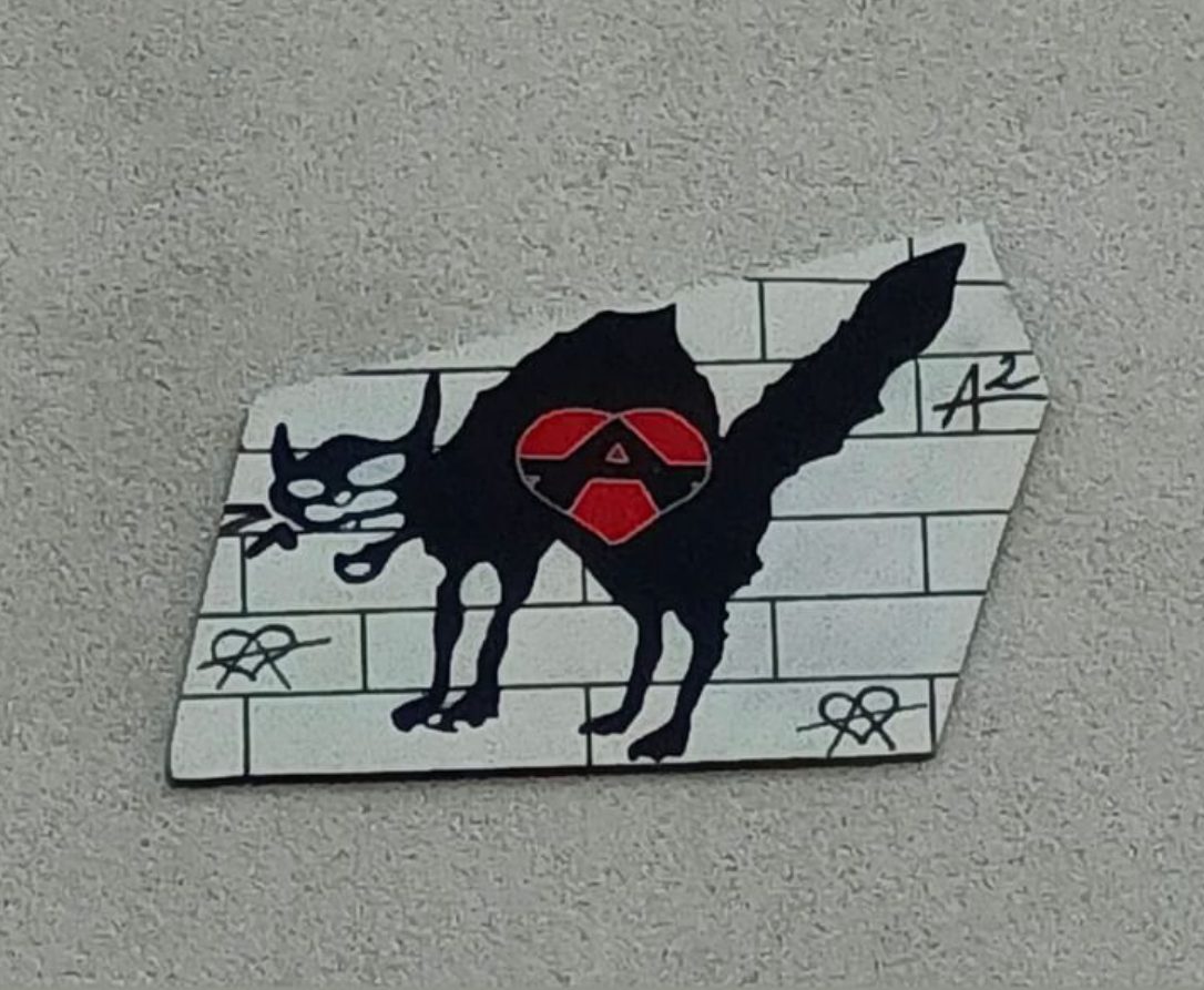 The Black Cat with the Anarchist Heart — Street art by A2 in Paris