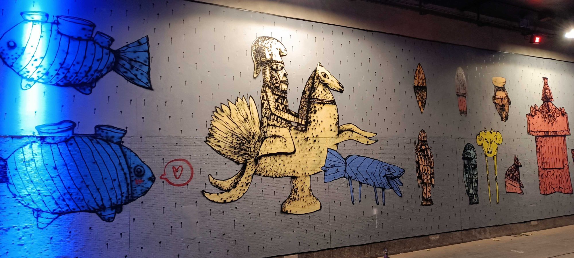 Knight Riding Winged Creature with Blue Fish — Street art in Paris