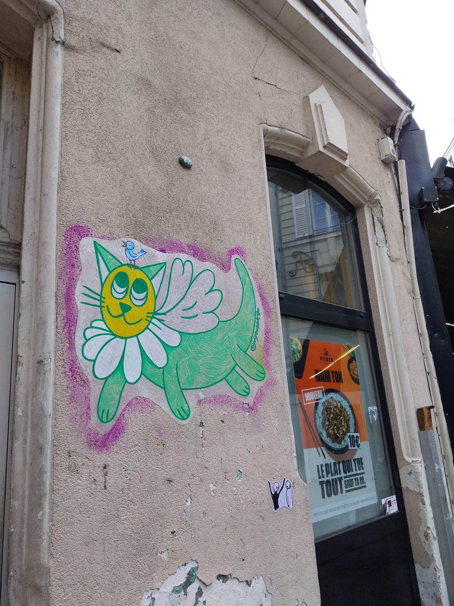 The winged daisy cat — Street art by JulyBubble in Angers