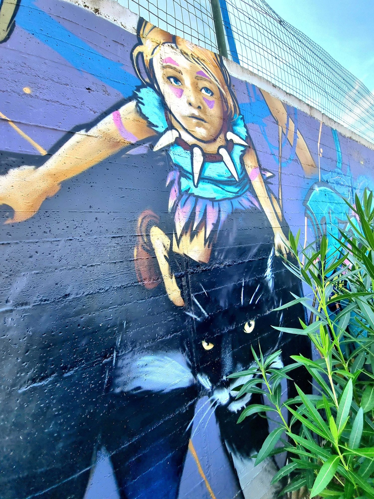 The Girl with the Black Cat — Street art in Vallon-Pont-d'Arc