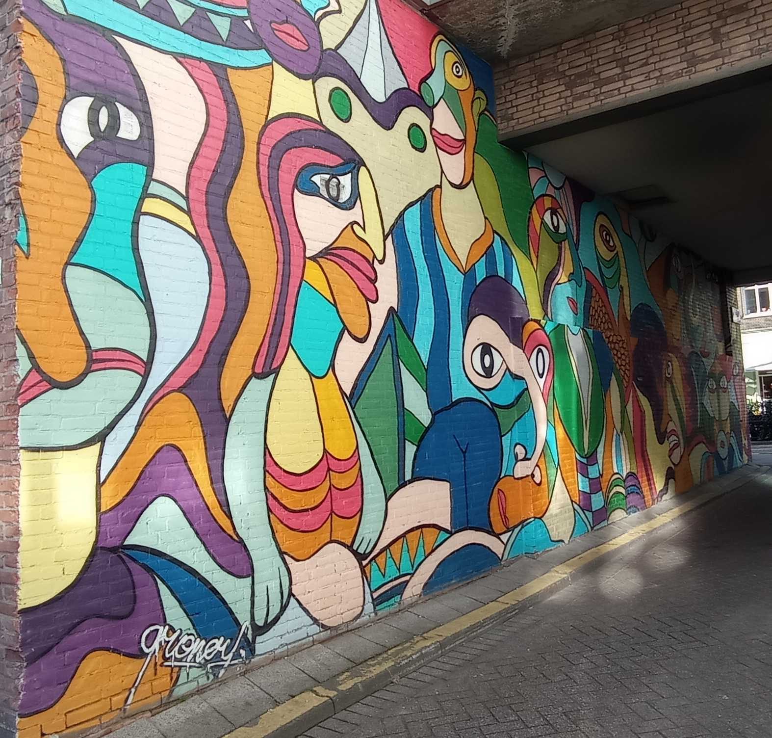 Interlocking Faces and Birds — Street art in Rotterdam