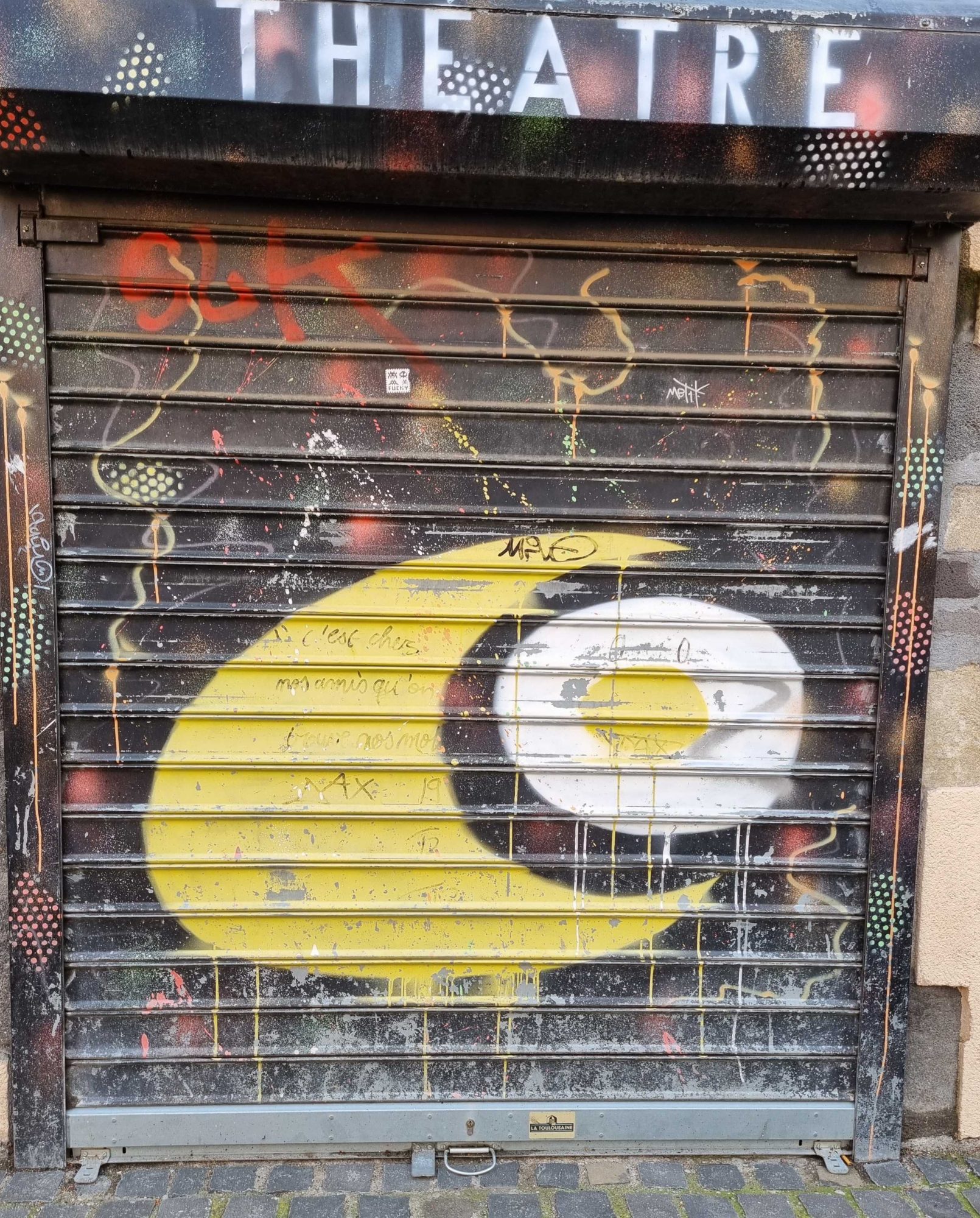 Yellow Crescent beneath the Theatre Sign — Street art in Clermont-Ferrand