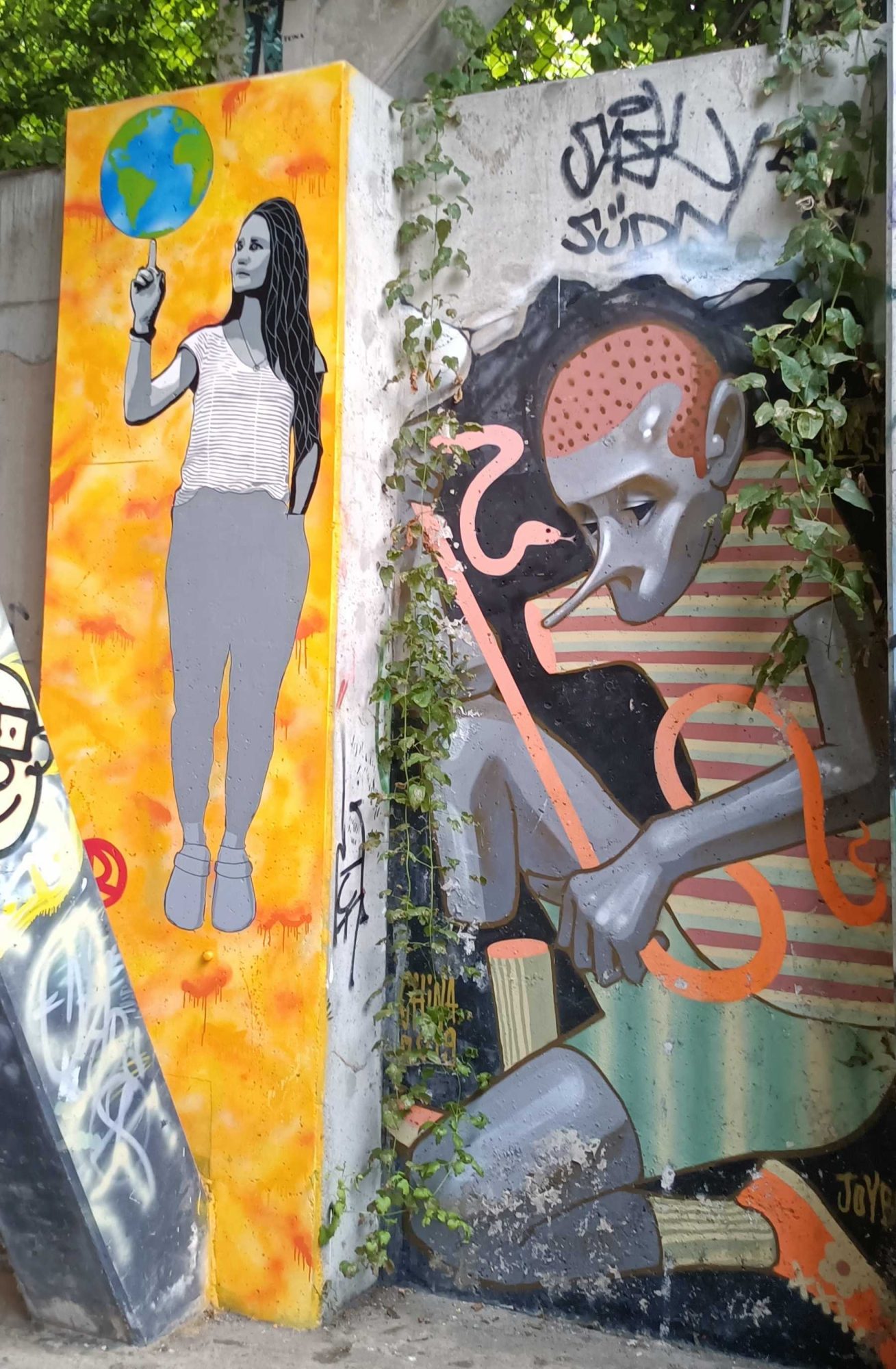 The Woman with the Earth and the Grey Creature — Street art in Berlin