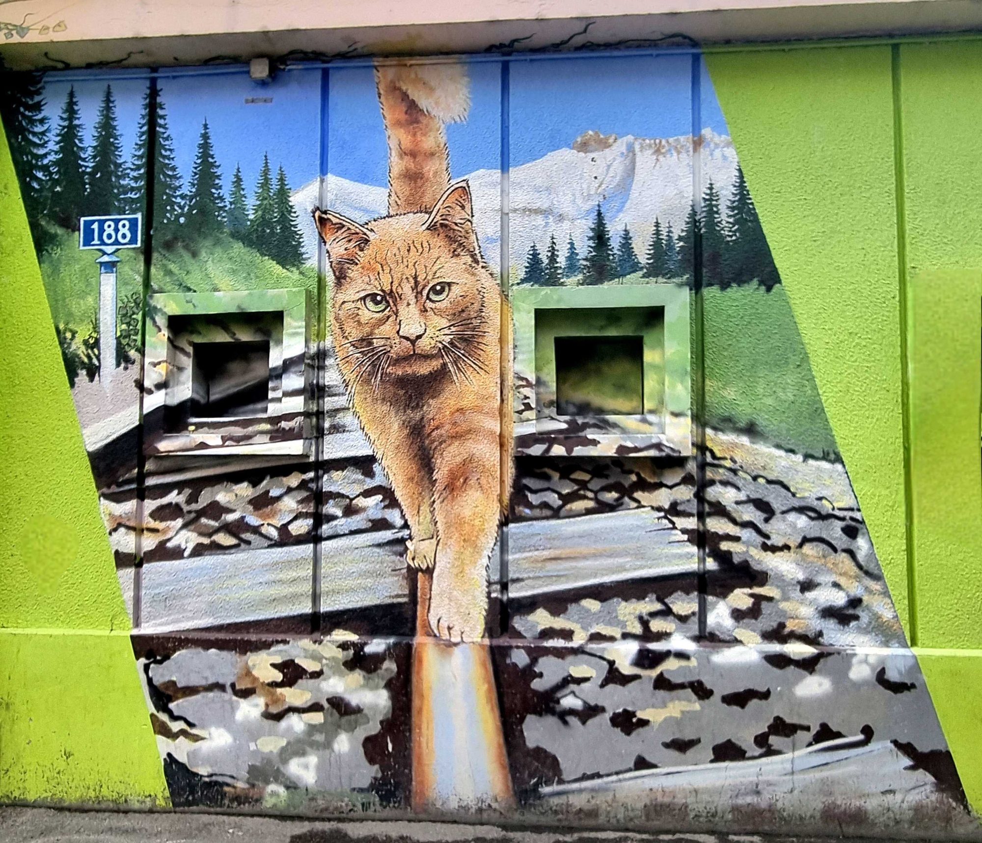 Ginger Cat Walking on Alpine Rails — Street art in Grenoble
