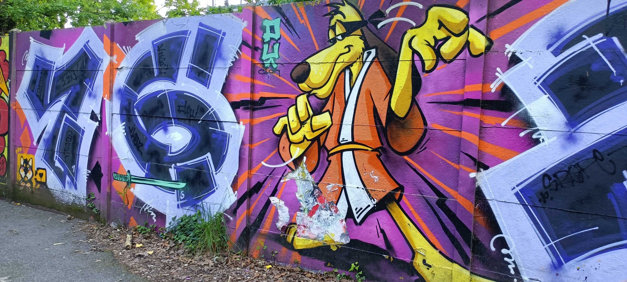 The Dog in a Raincoat — Street art in Nantes