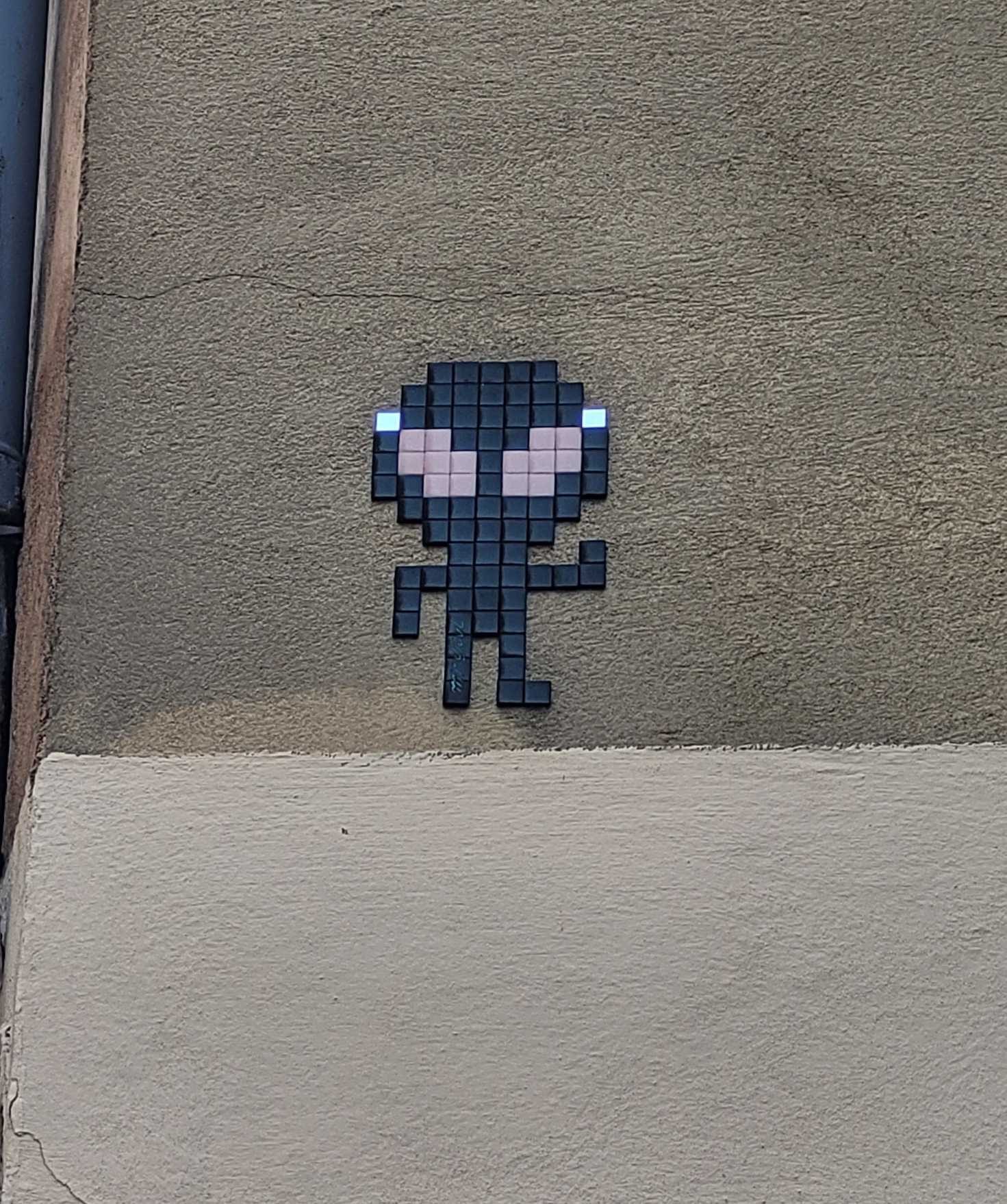 The Small Big-Headed Pixel Figure — Street art by Mr Djoul in Toulouse