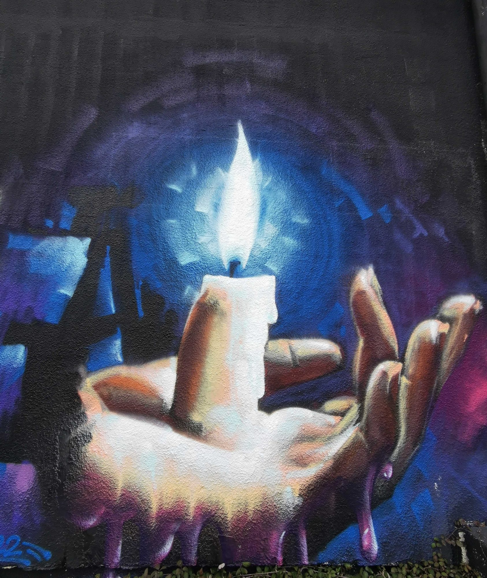Main tenant une bougie, Redon — Street art à Redon