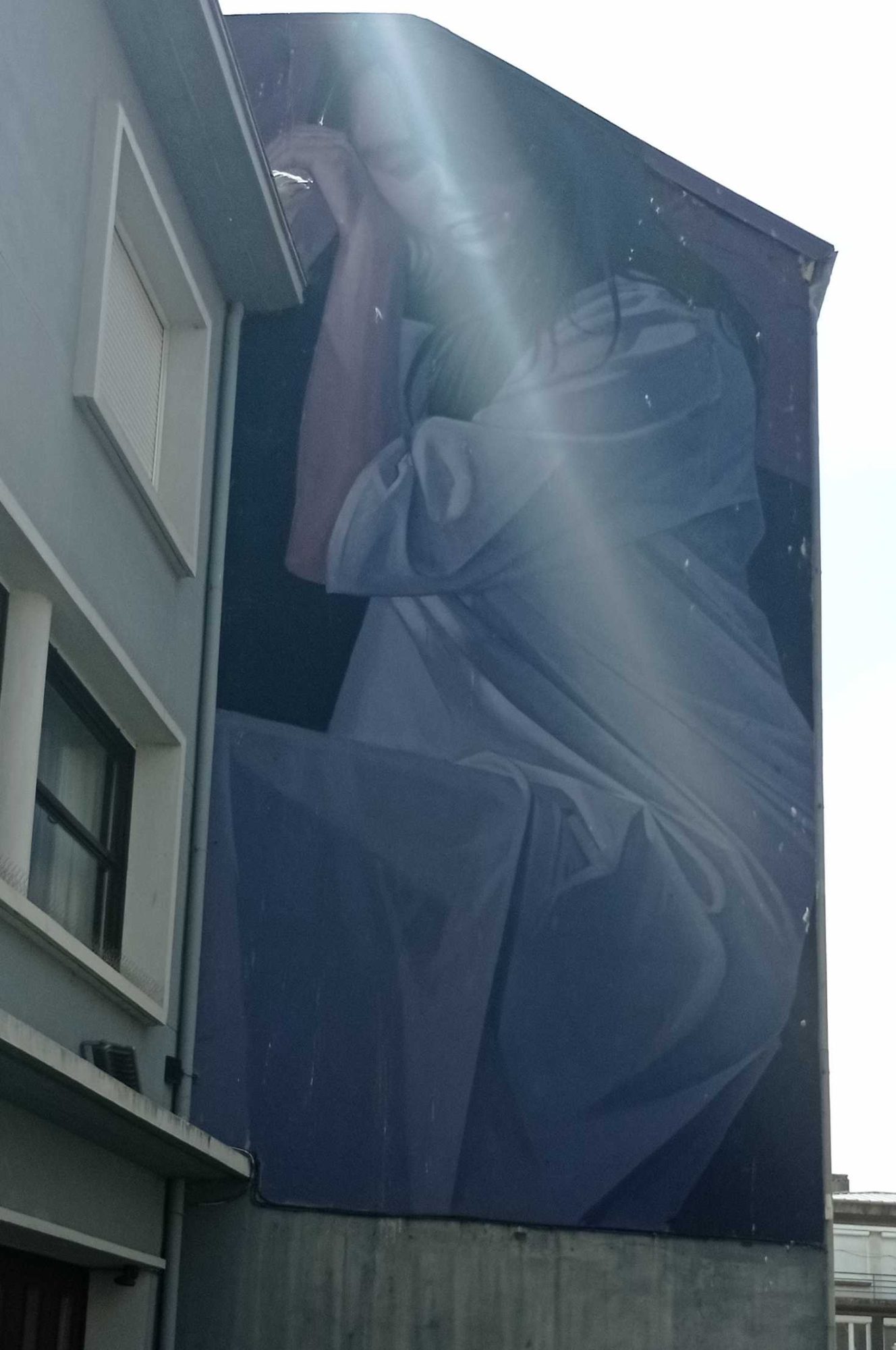 The Large Figure Draped in Blue — Street art by LONAC in Boulogne-sur-Mer