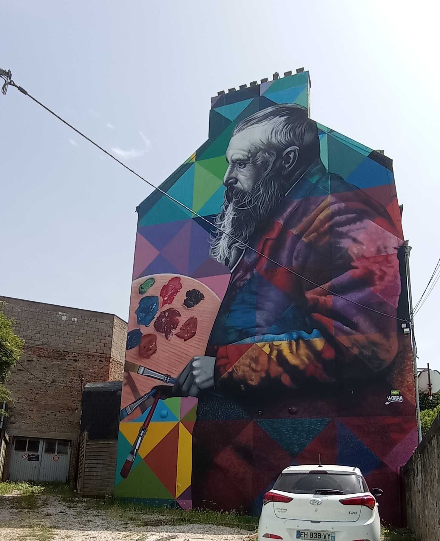 Kobra multicolor portrait tribute — Street art by Eduardo Kobra in Boulogne-sur-Mer