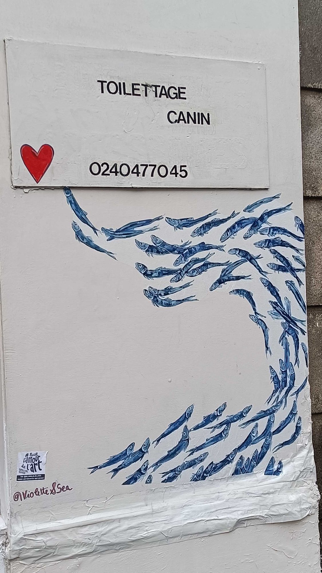 School of Fish in Blue Wave — Street art in Nantes