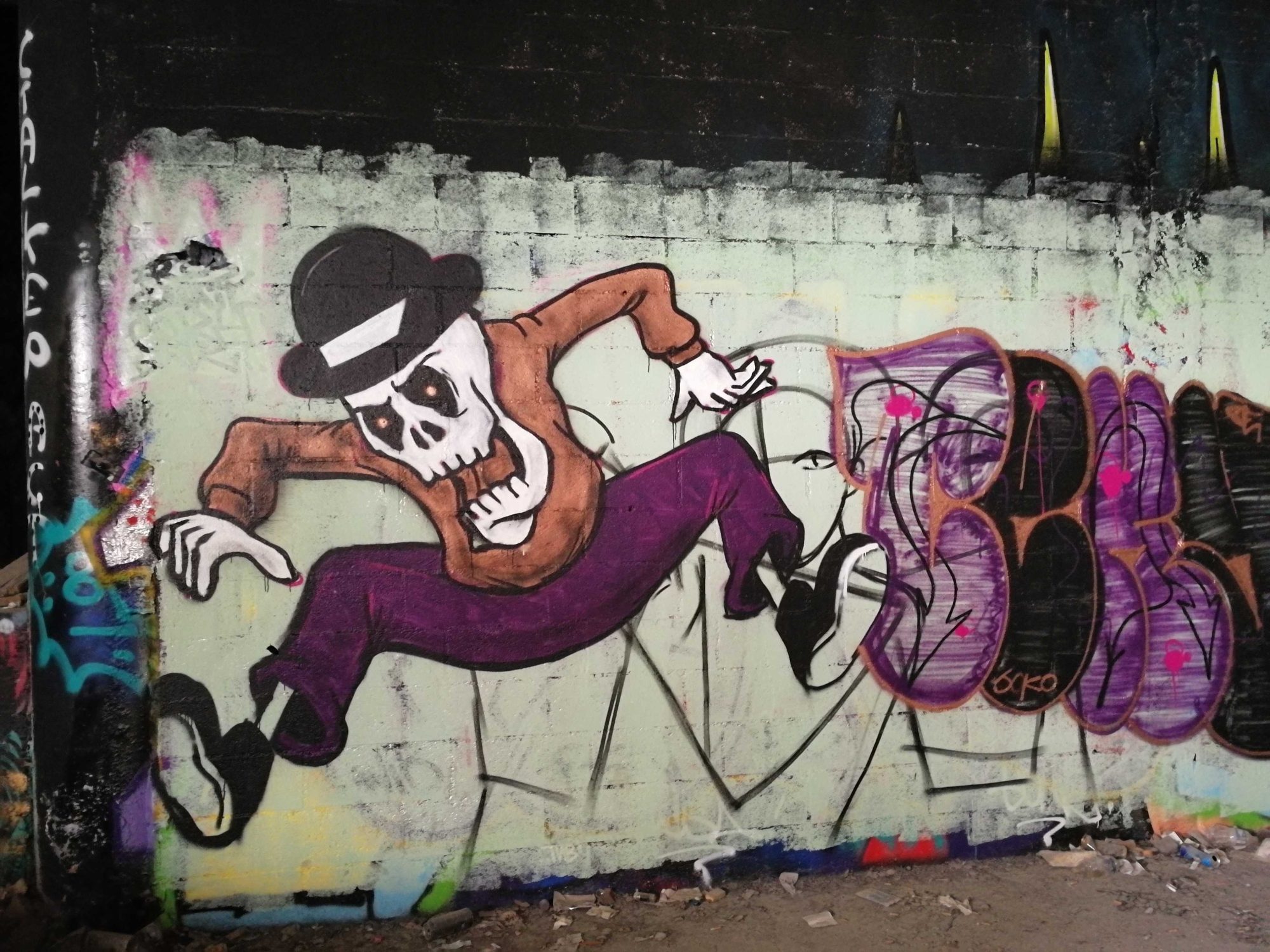 Dancing Skeleton with a Hat — Street art in Paris