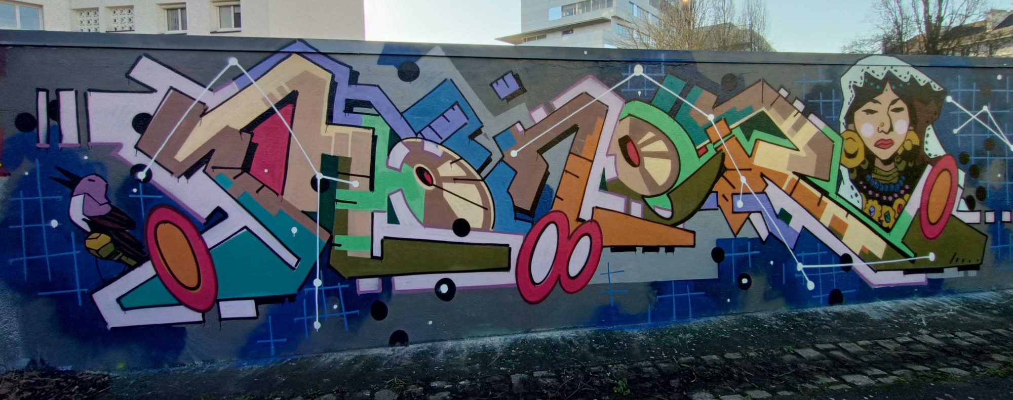 The Lettering and the Woman with Golden Earrings — Street art in Nantes