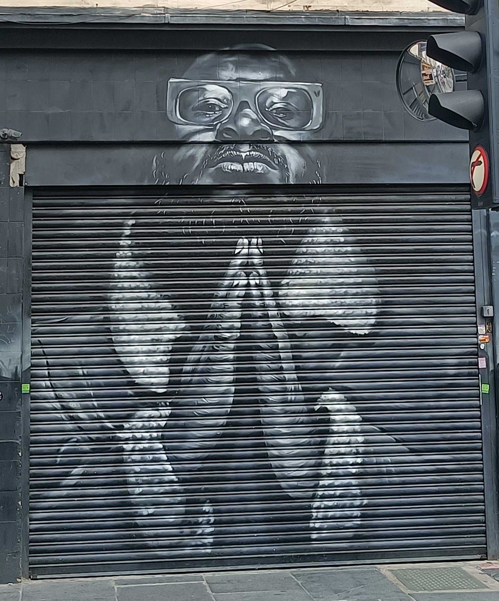 Photorealistic portrait shutter — Street art in London