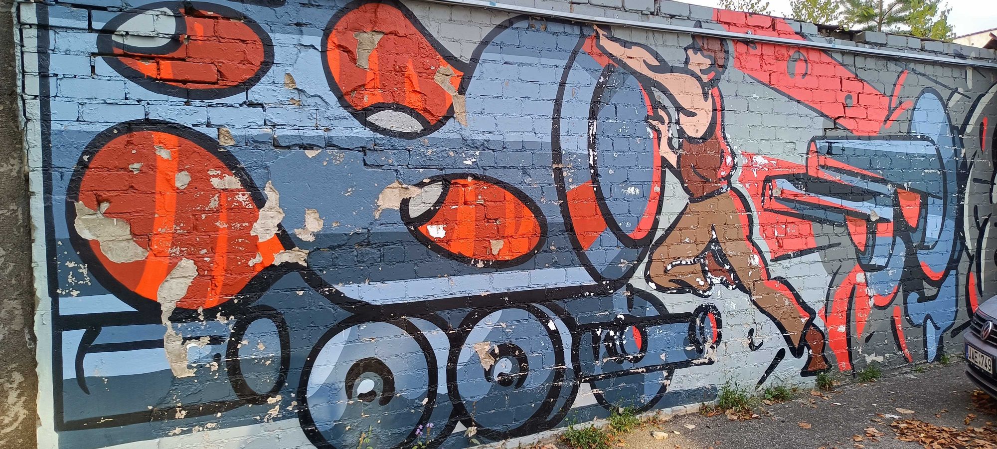Locomotive Pushed by a Man — Street art in Vilnius