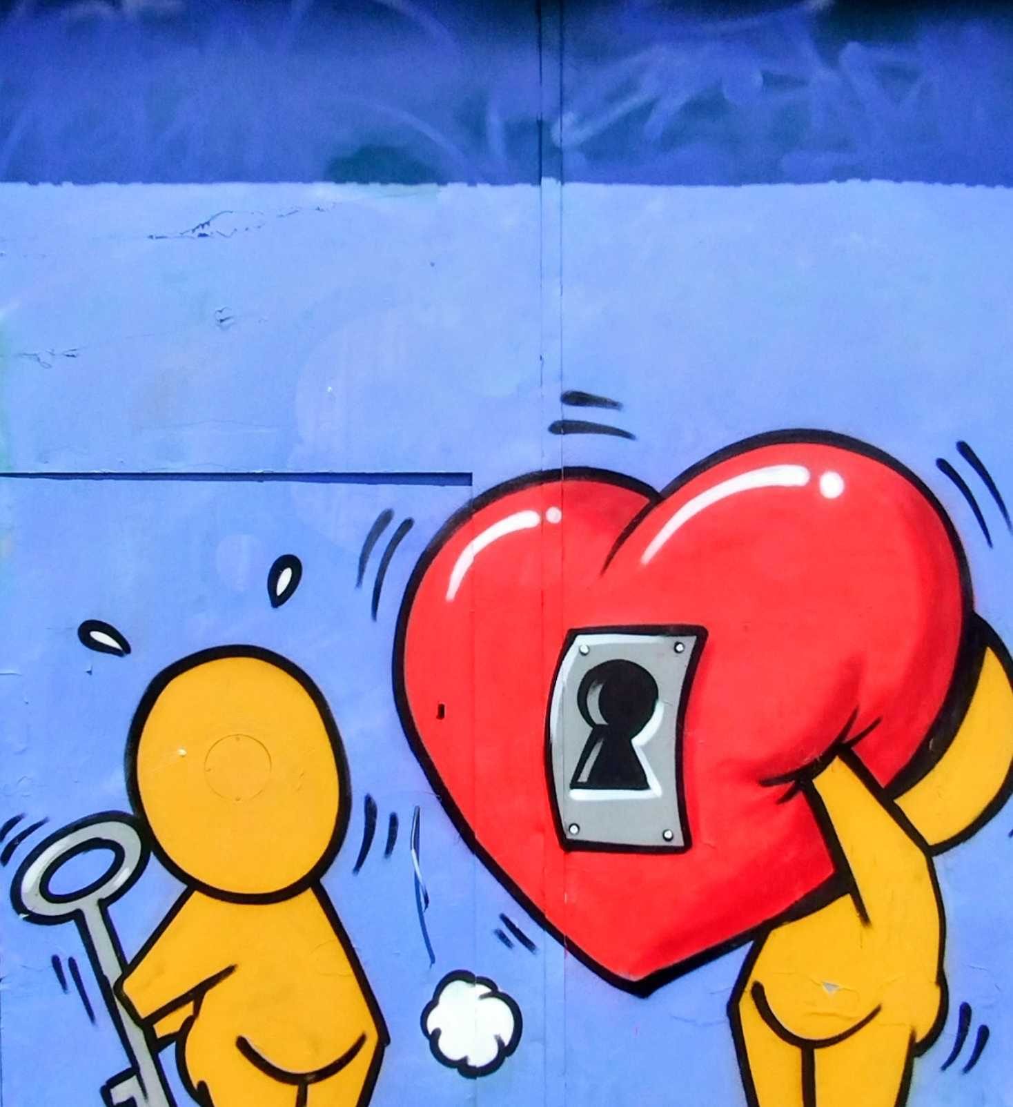 Giant Heart Carried by Two Figures — Street art by Jace in Saint-Denis