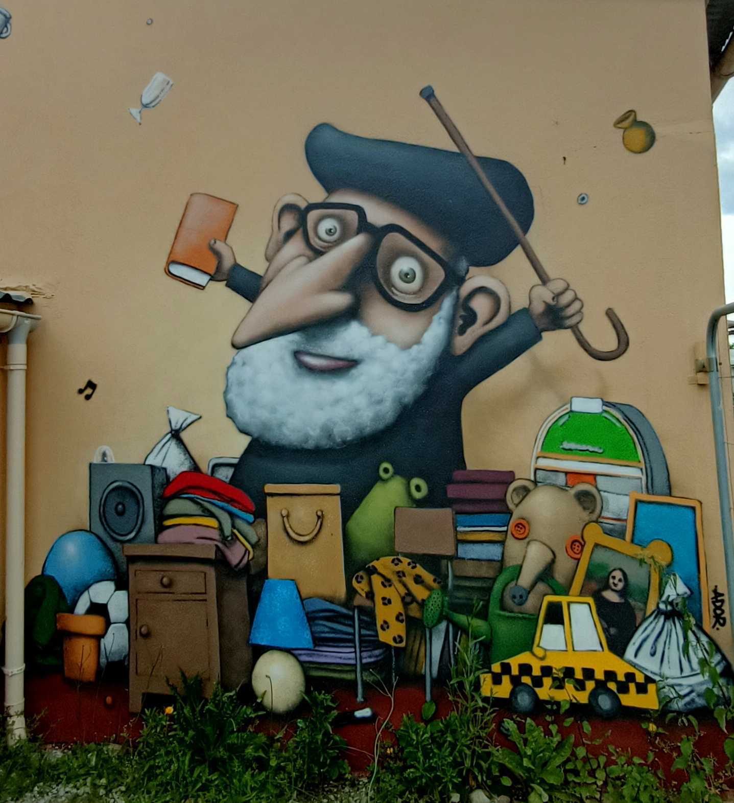 Old Man with Assorted Objects by Ador — Street art by Ador in Bouguenais