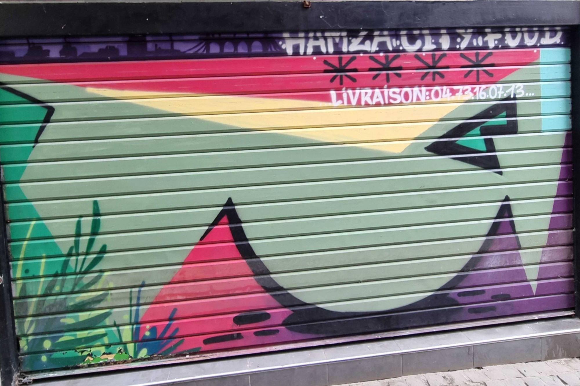 Colorful Hamza City Food Shutter — Street art in Clermont-Ferrand