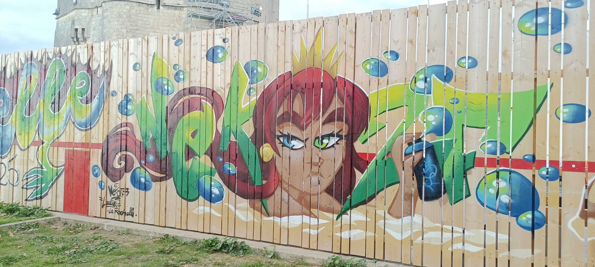 Red-Haired Queen with Bubbles — Street art in La Rochelle