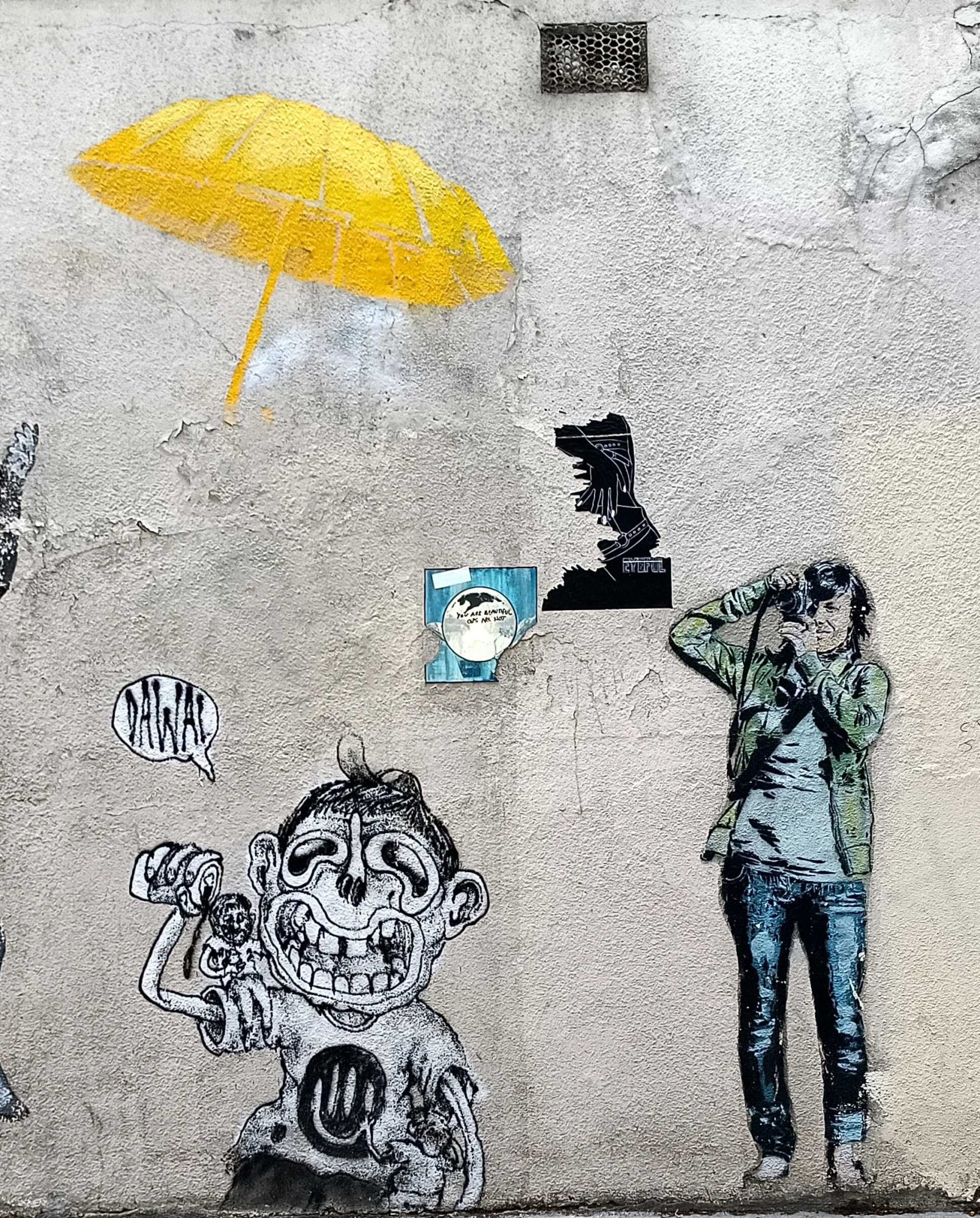 Yellow Umbrella and Photographer on Wall — Street art in Paris