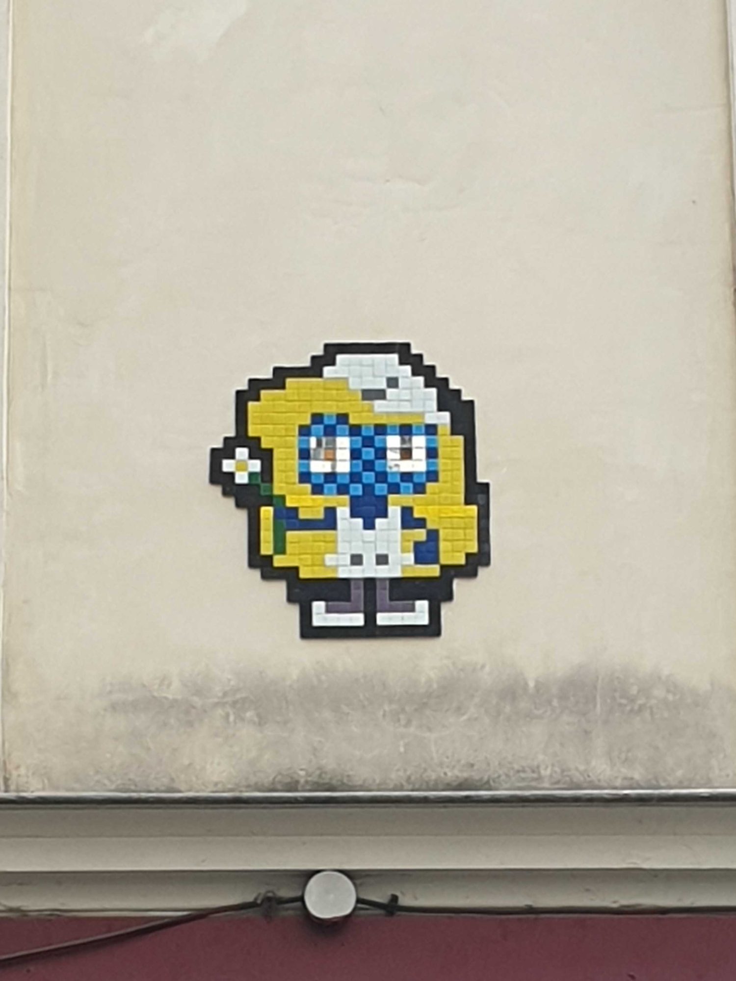 Smurfette mosaic on Rue de Rivoli — Street art by Invader in Paris