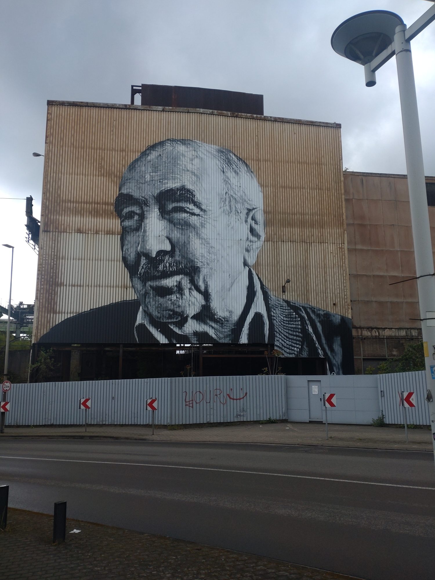Realistic Monochrome Male Portrait — Street art by Hendrik Beikirch in Saarbrücken