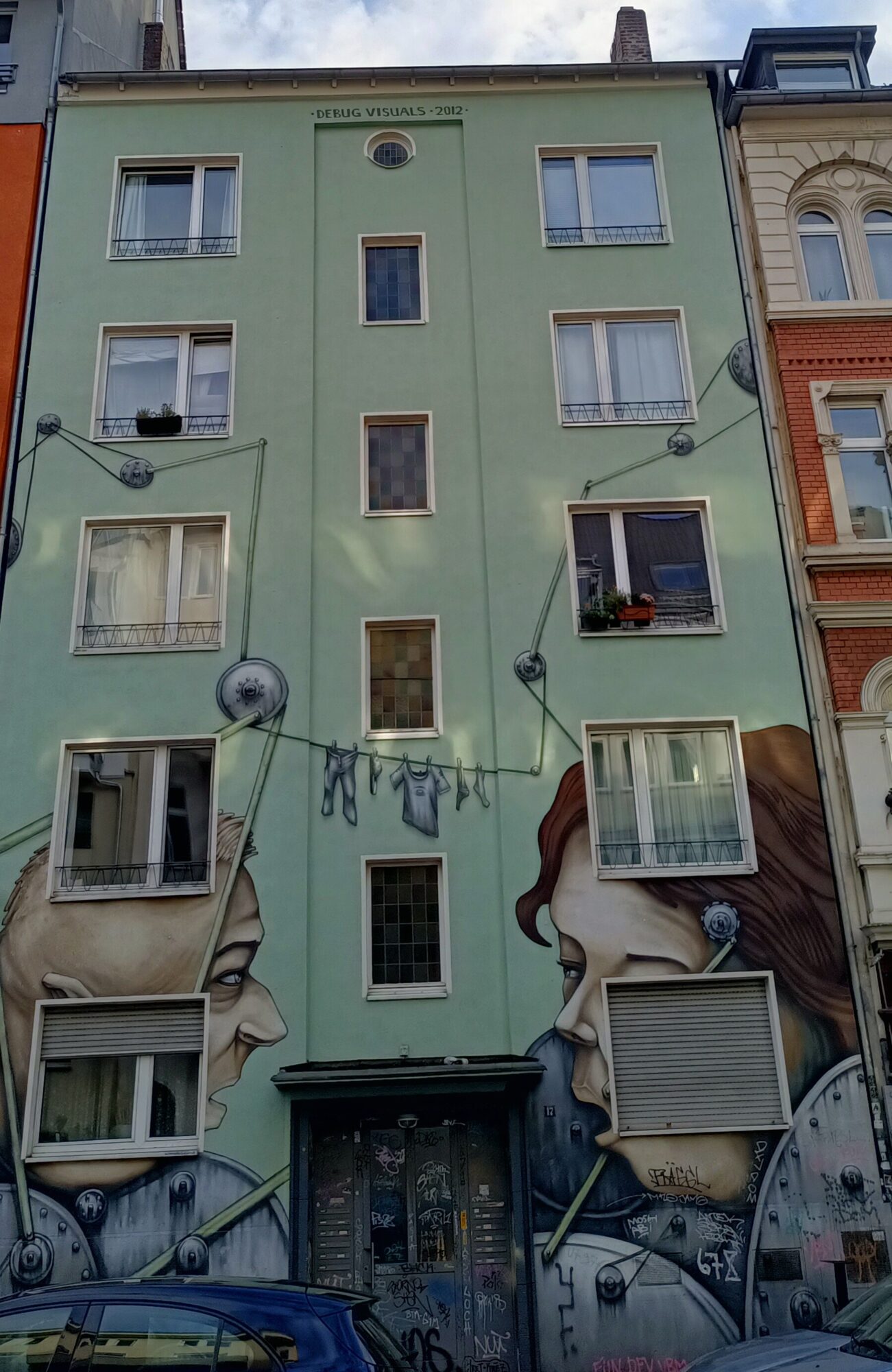 Neighbours, les deux voisins de Debug Visuals — Street art de Debug Visuals à Köln
