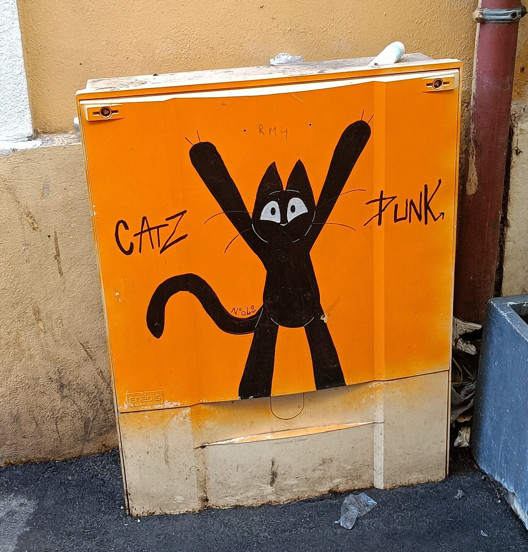 Catz Punk Black Cat on an Orange Cabinet — Street art by Catz Punk in Marseille
