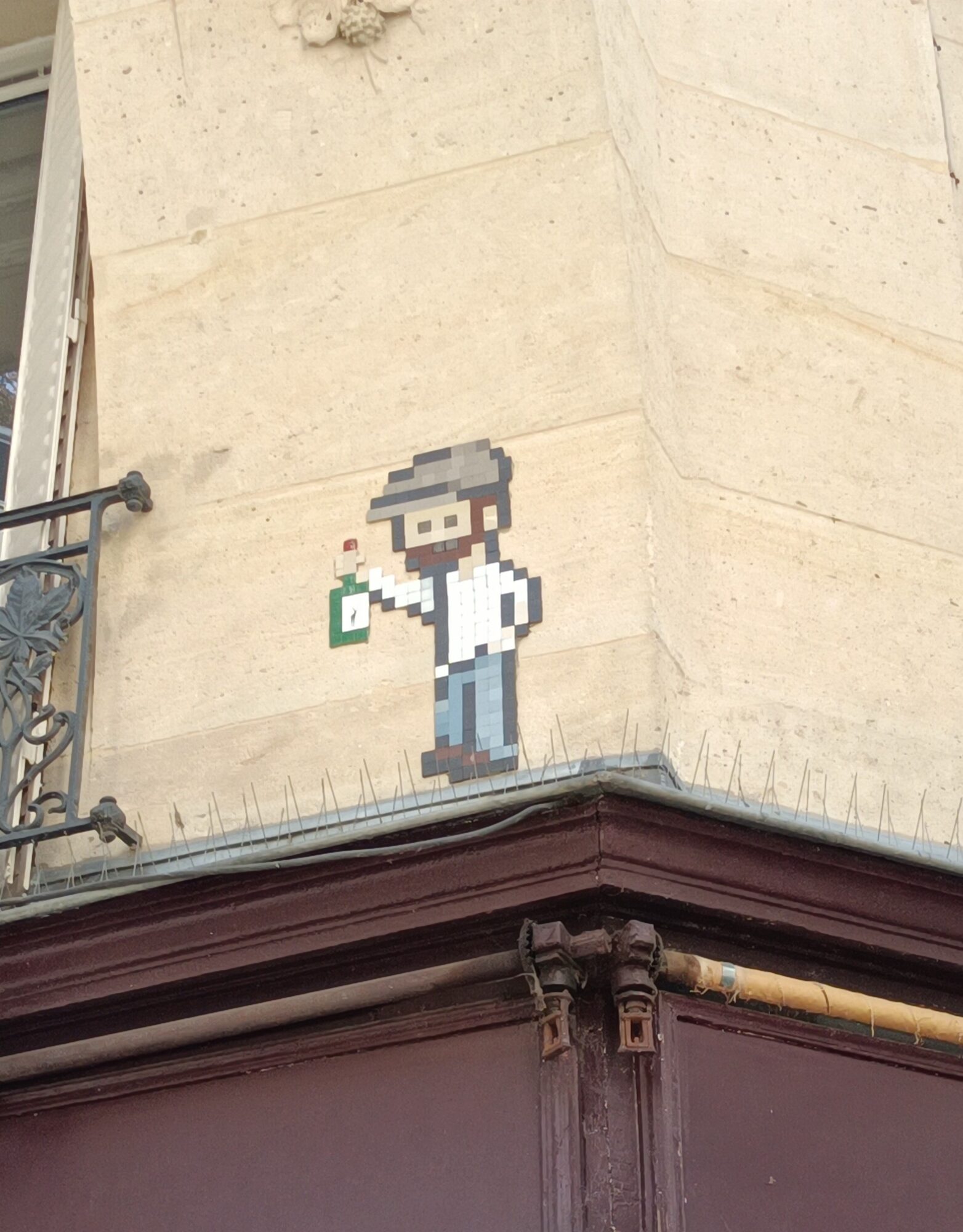 The man with a cap and a bottle — Street art in Paris