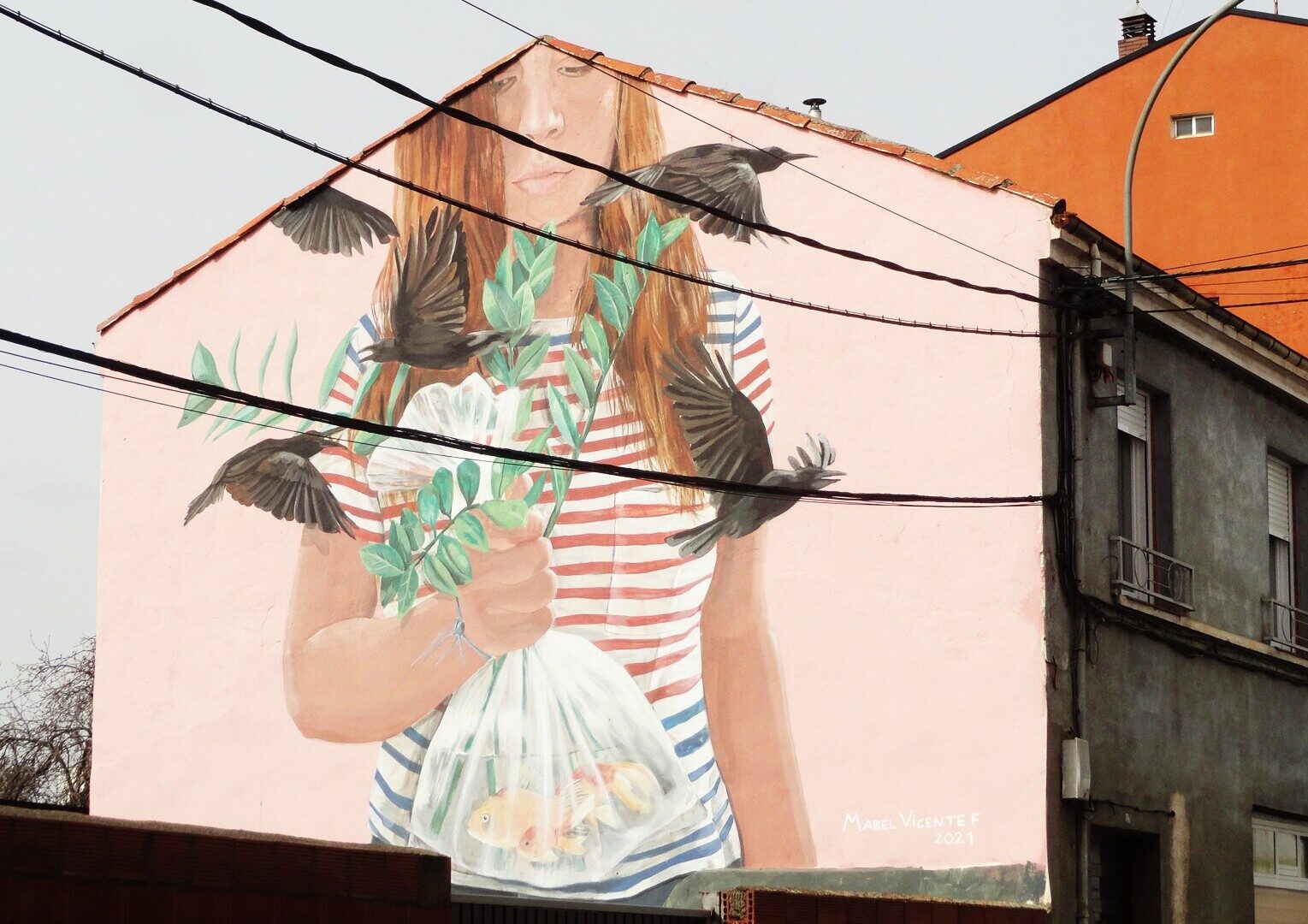 The Saved Fish — Street art by Mabel Vicentef in La Bañeza