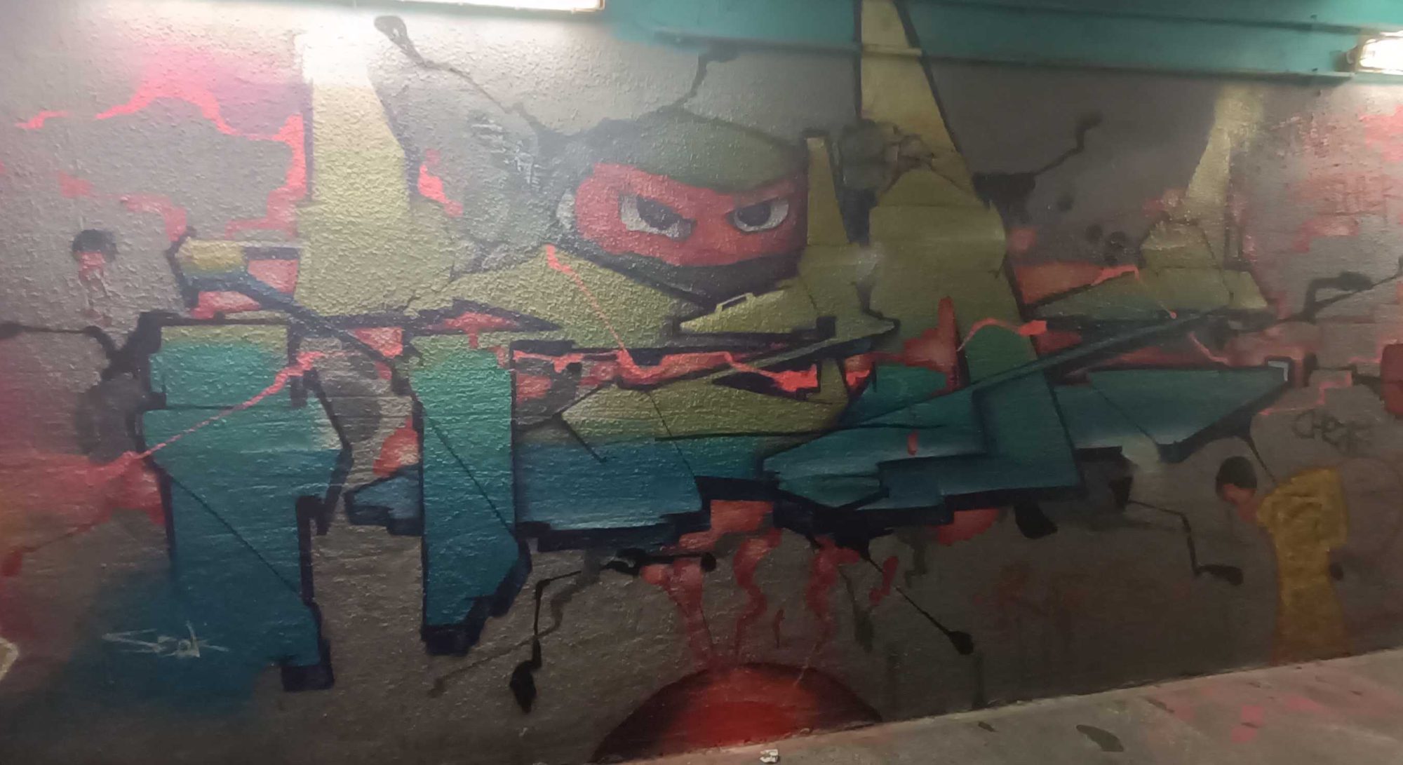 Red Ninja Emerging from Cracked Wall — Street art in Prague