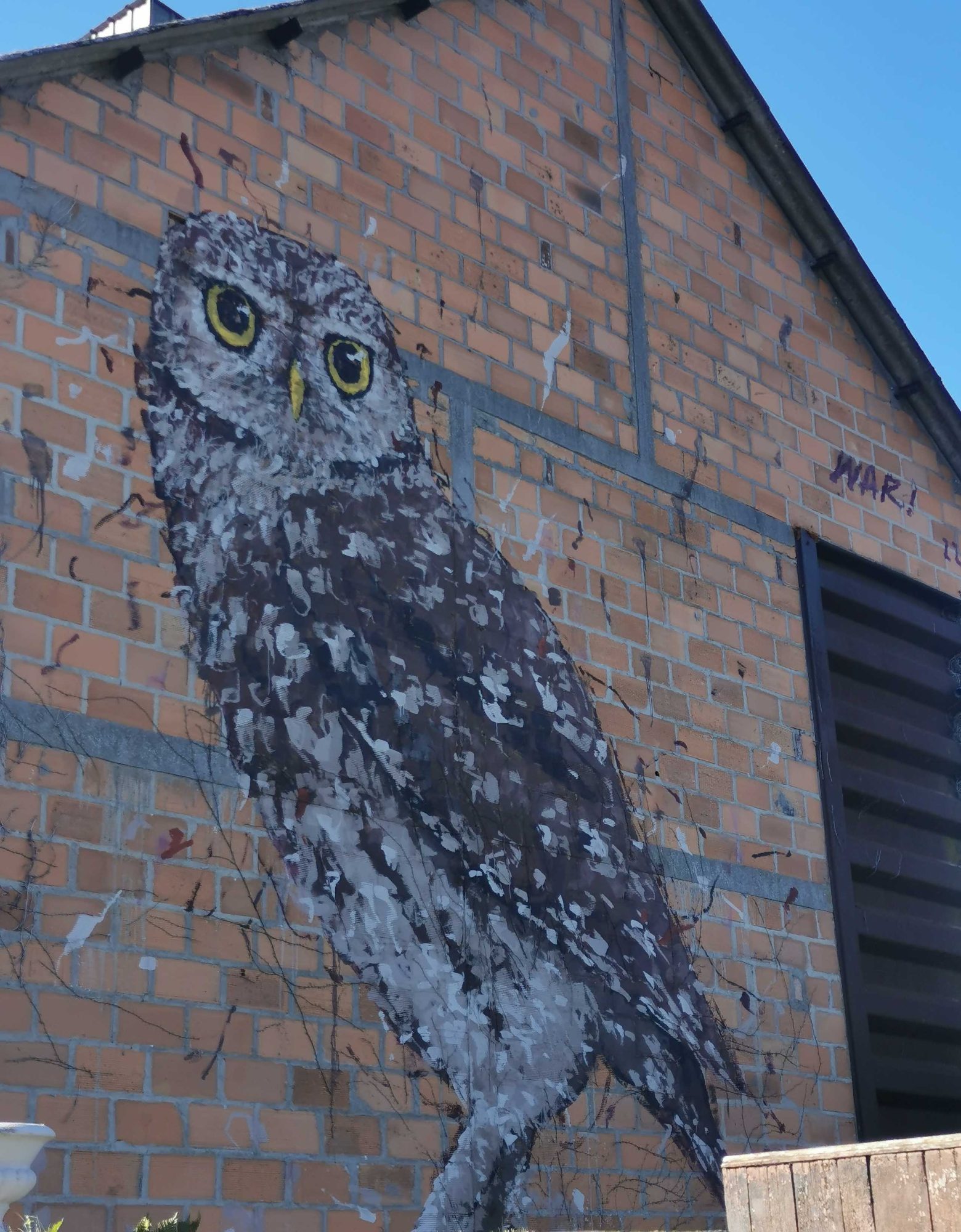 Gray Owl on Brick Wall — Street art by War in Marcillé-Robert