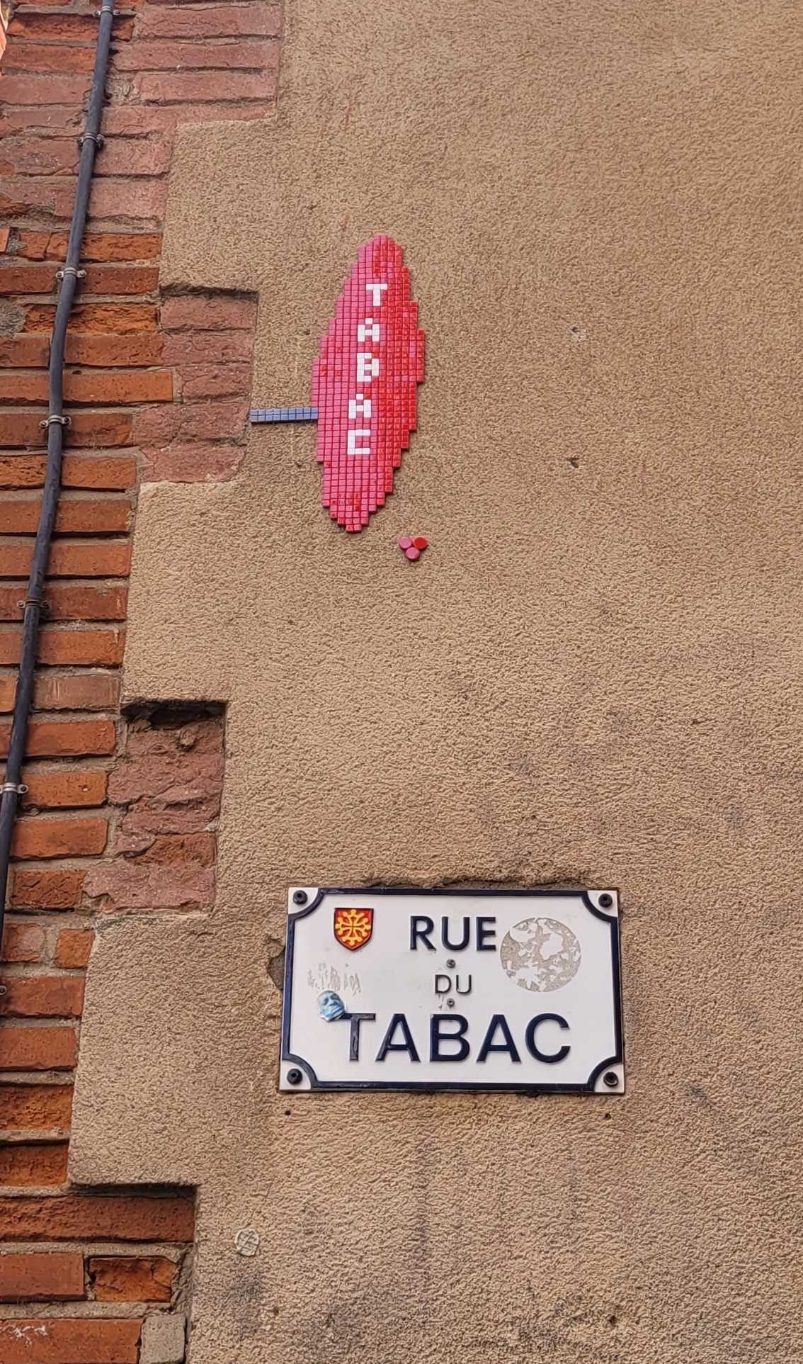 The Mosaic Tobacconist's Sign on Rue du Tabac — Street art by Mifamosa in Toulouse